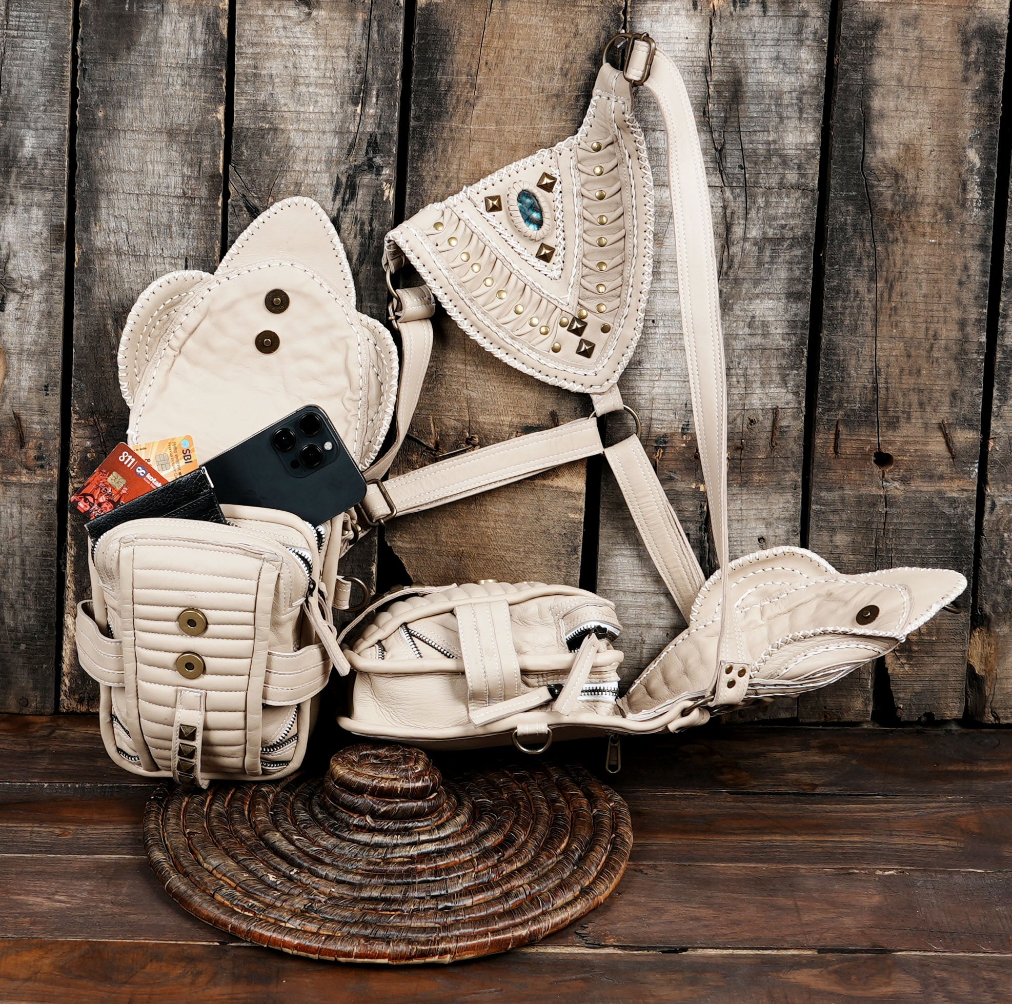Styled cream leather shoulder holster utility bag for hands-free festival wear.