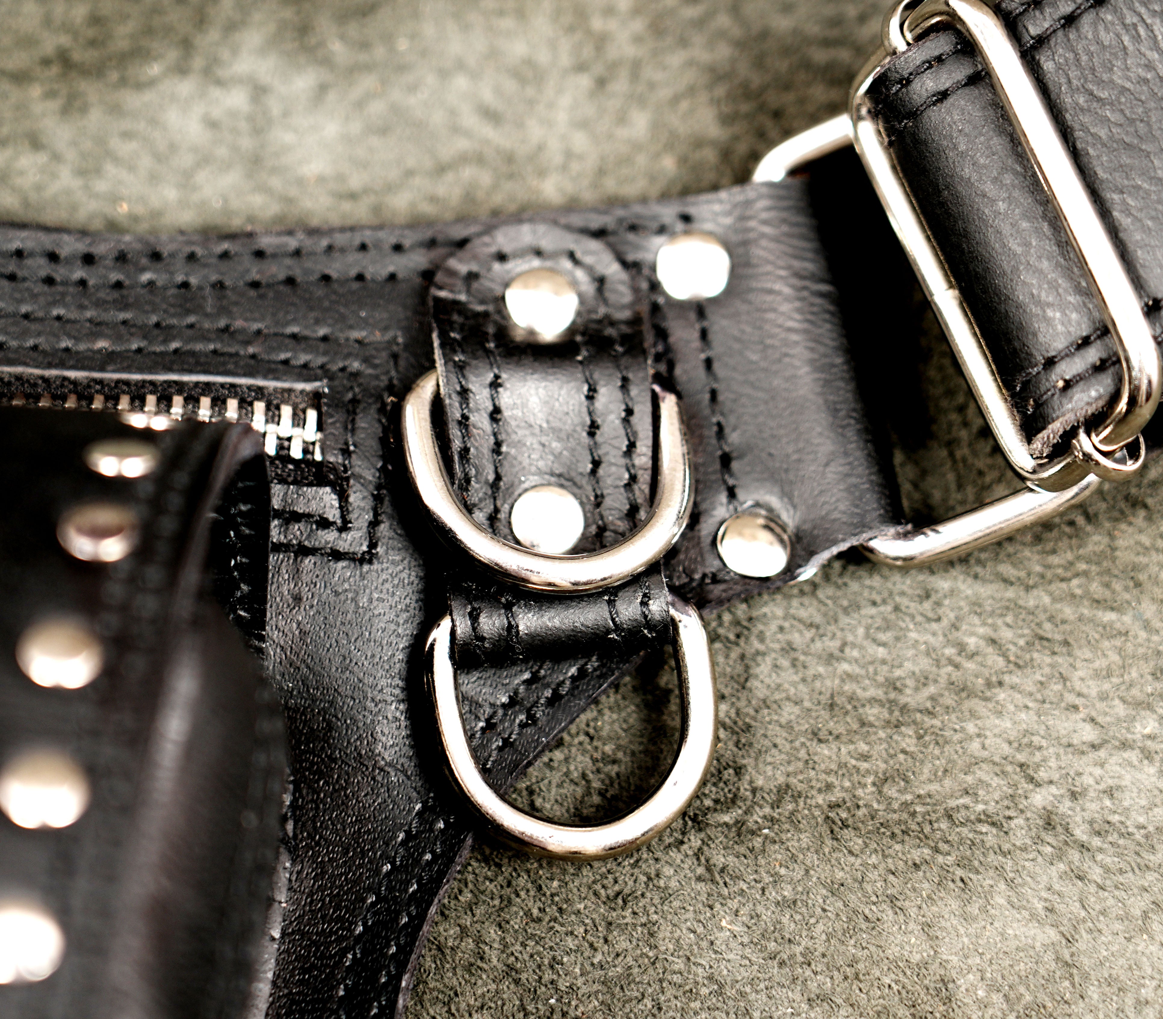 Biker style black leather drop leg pouch for motorcycle riding.