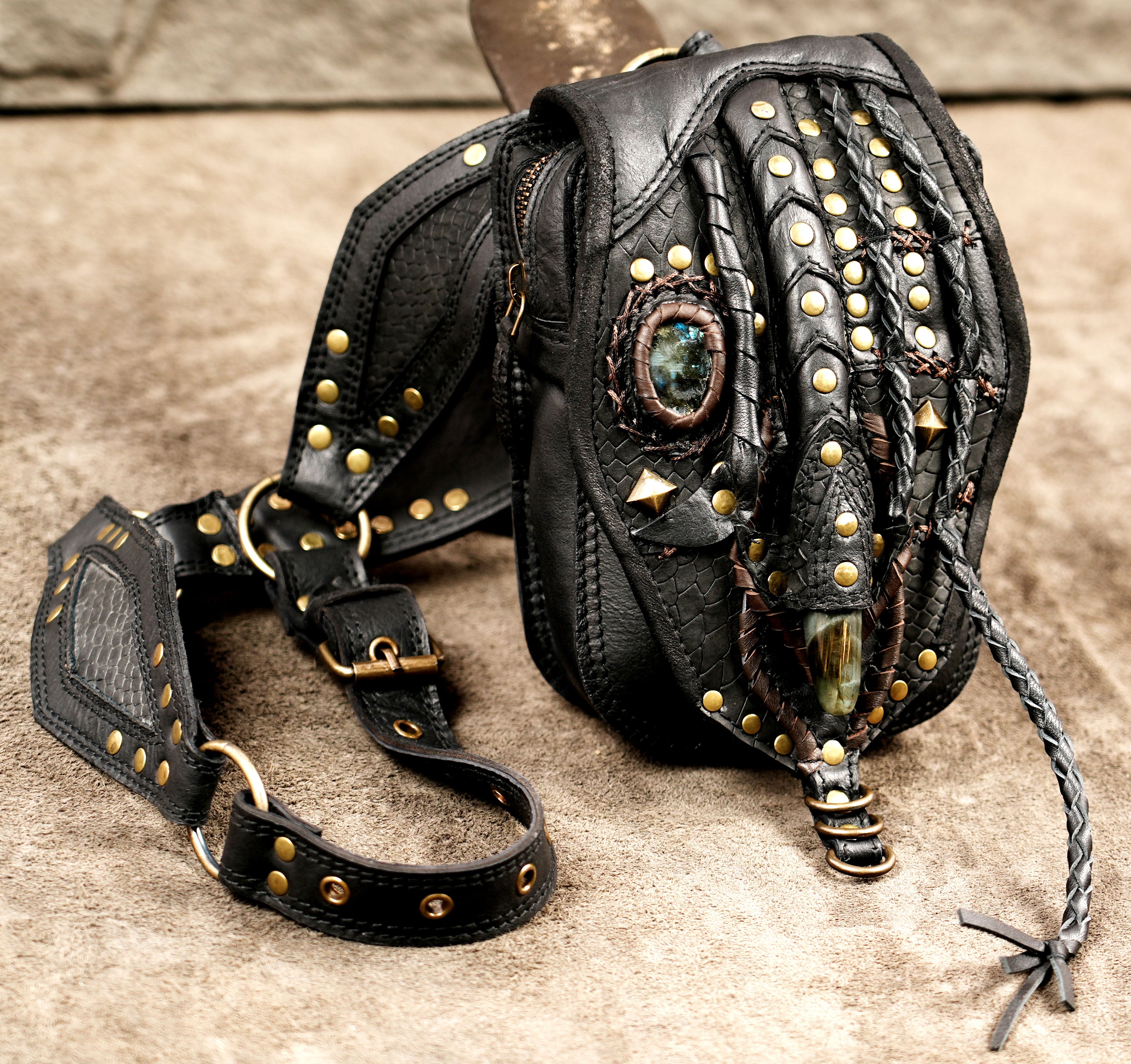 Gothic leather waist bag with antique brass rivets and braided leather detail
