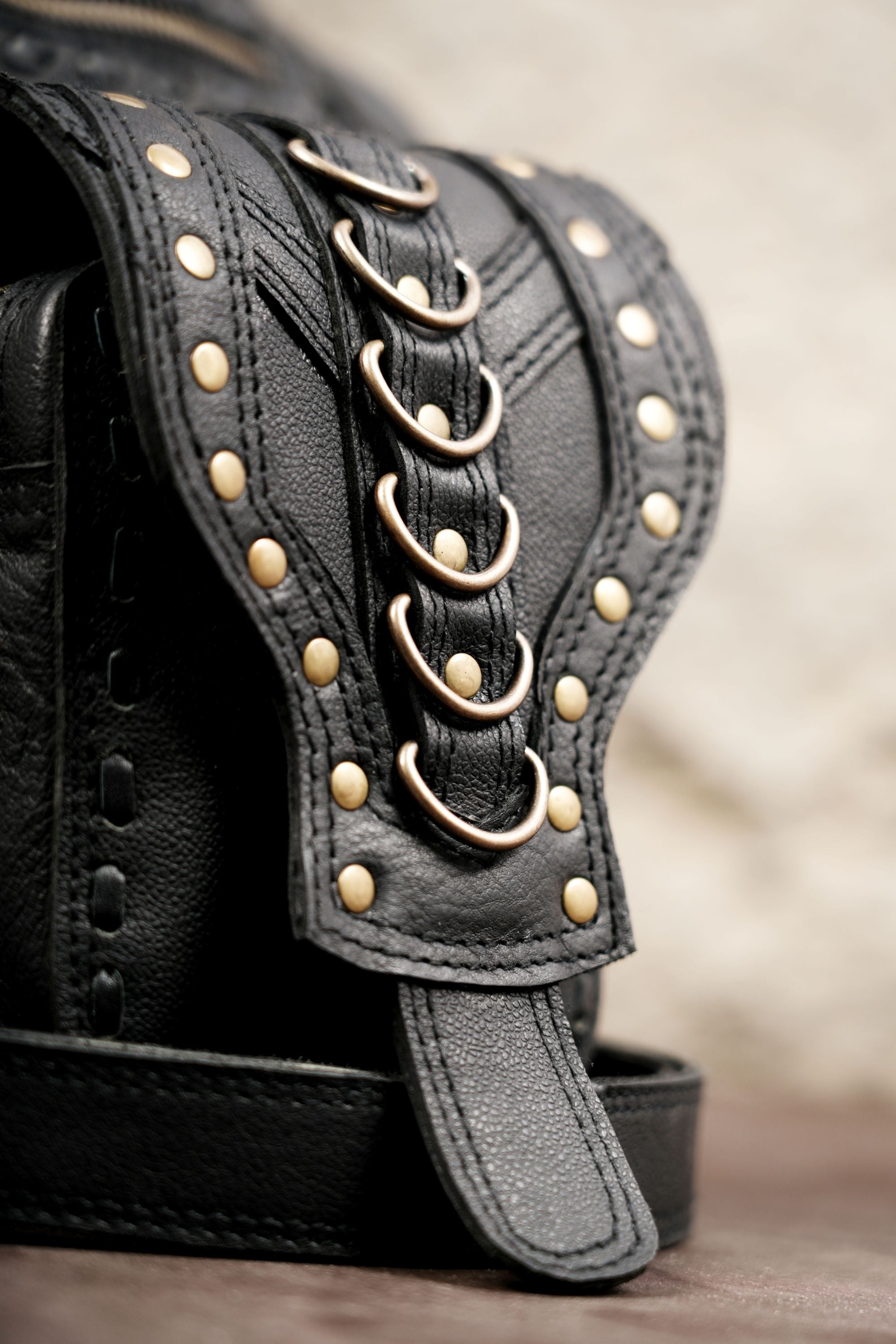 Gothic black leather thigh bag with antique brass hardware