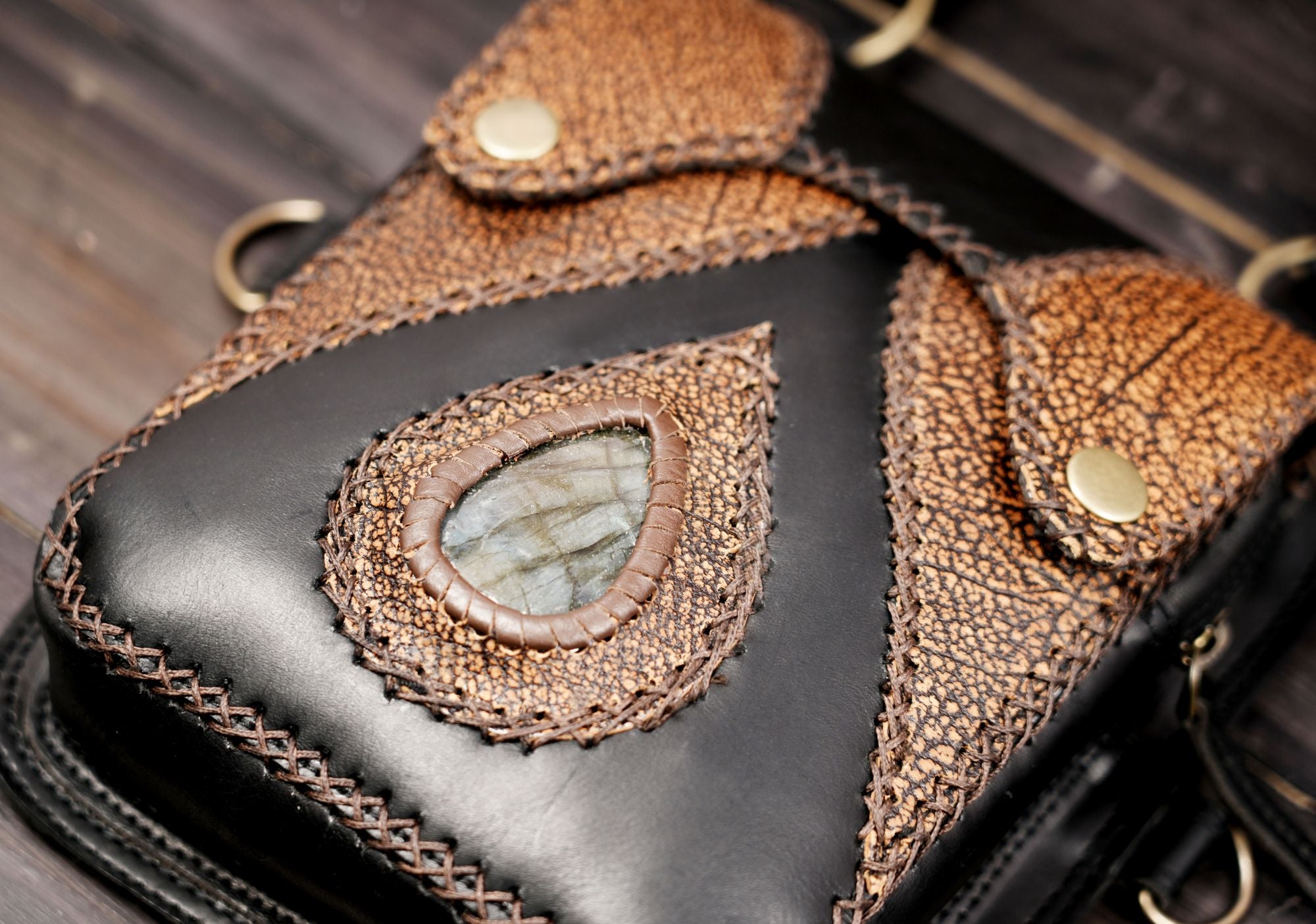 Dual pocket leather shoulder bag with natural stone detail
