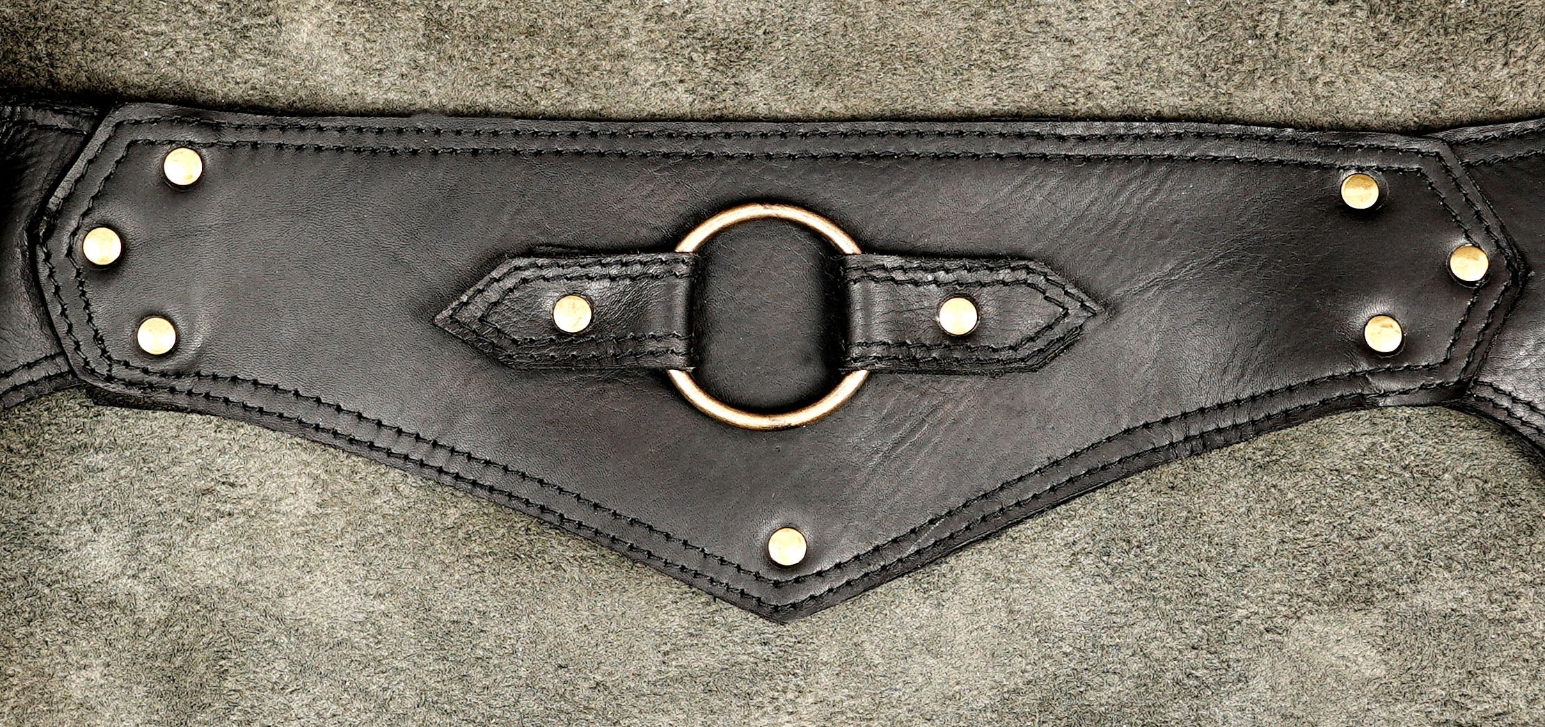 Handcrafted leather belt bag with pyramid-shaped pouch design     