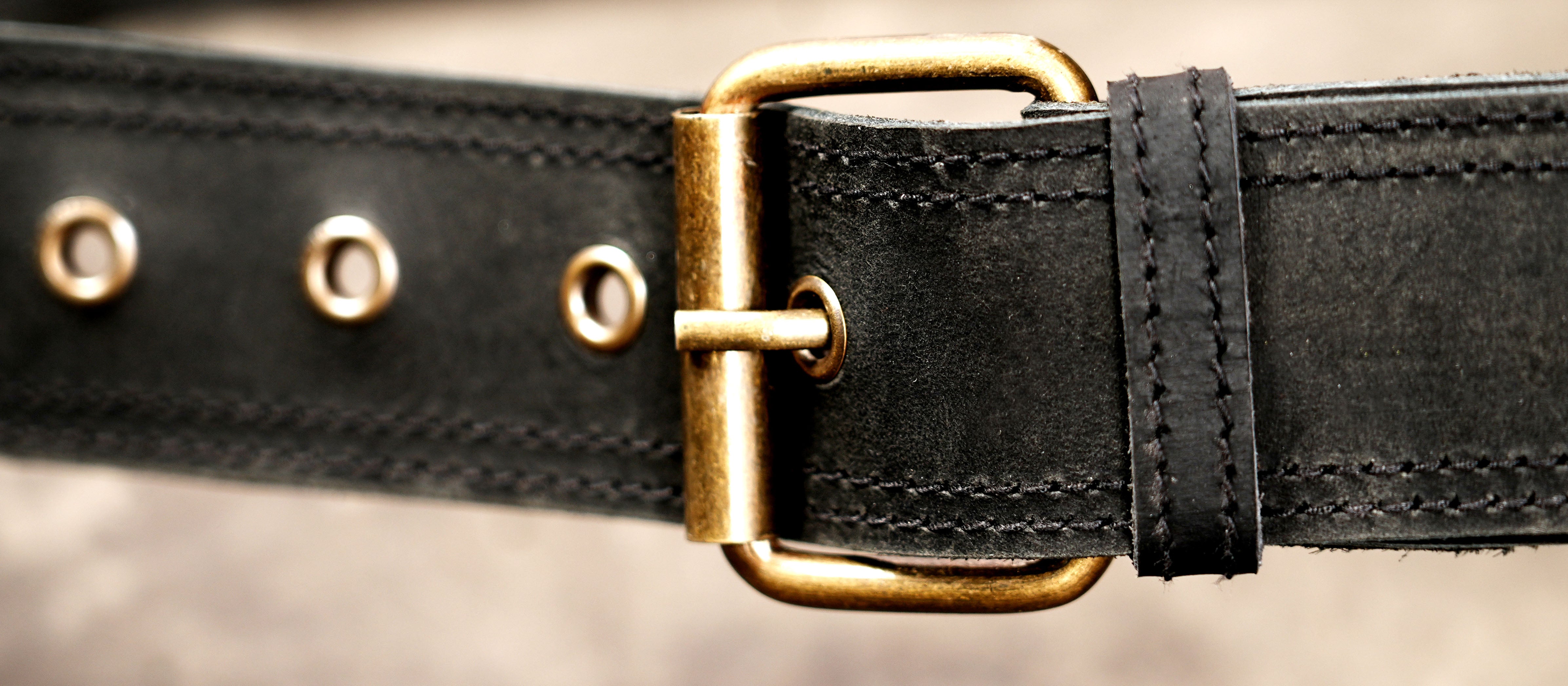 Labradorite gemstone leather belt pouch with long black fringe detailing.