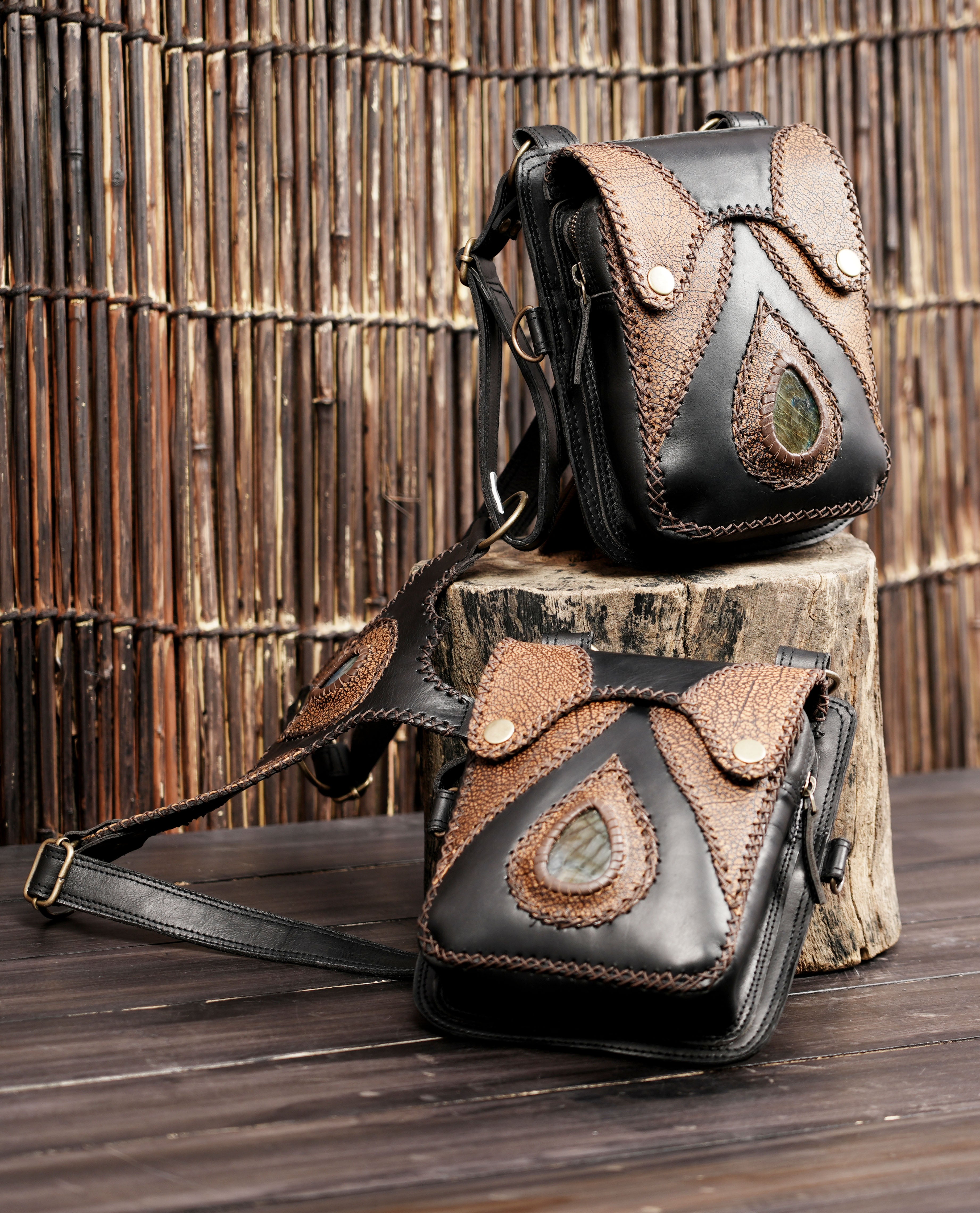 Leather shoulder rig with twin pouches and gemstone centerpiece