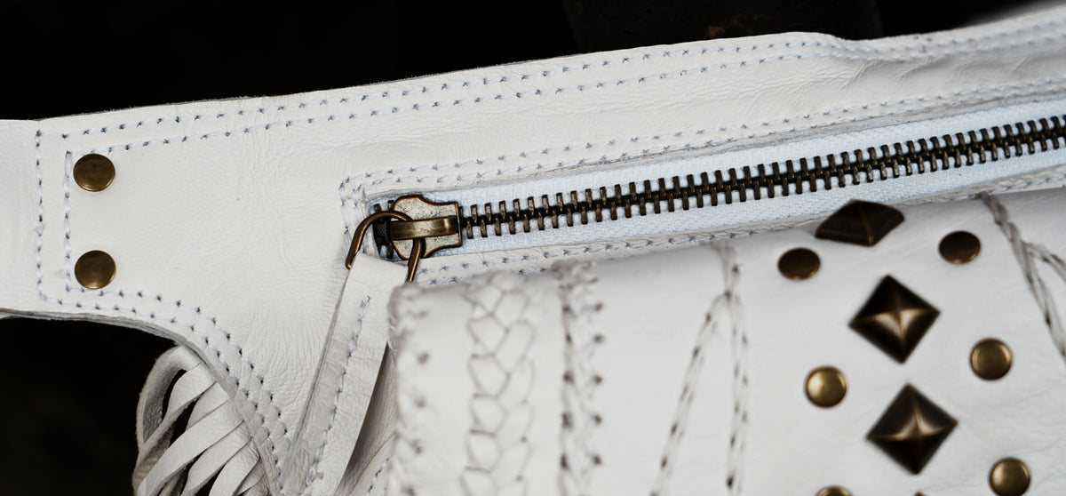 Boho white leather waist bag with fringe and decorative stone

