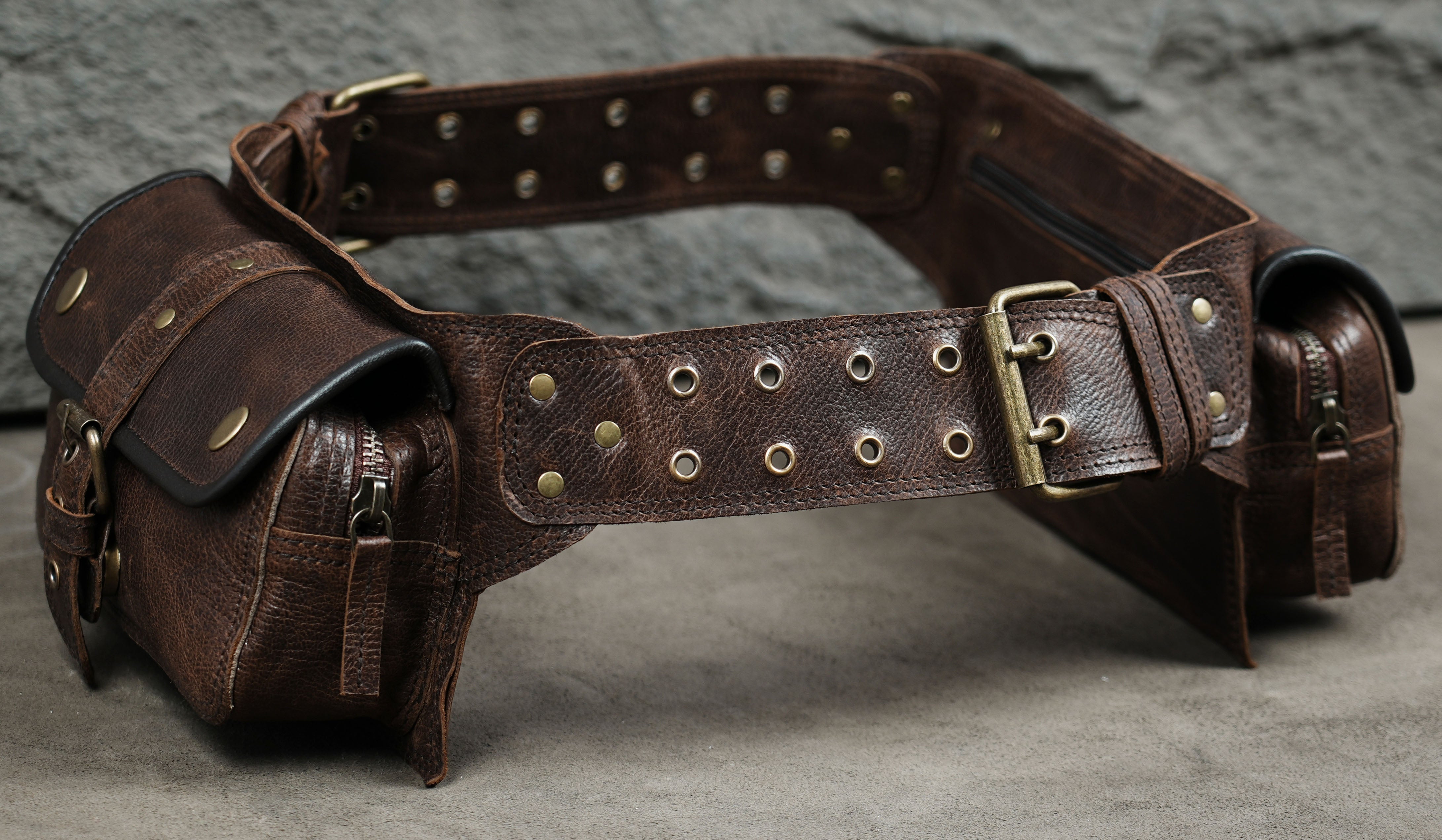 Adjustable leather waist bag with dual pouches and brass hardware