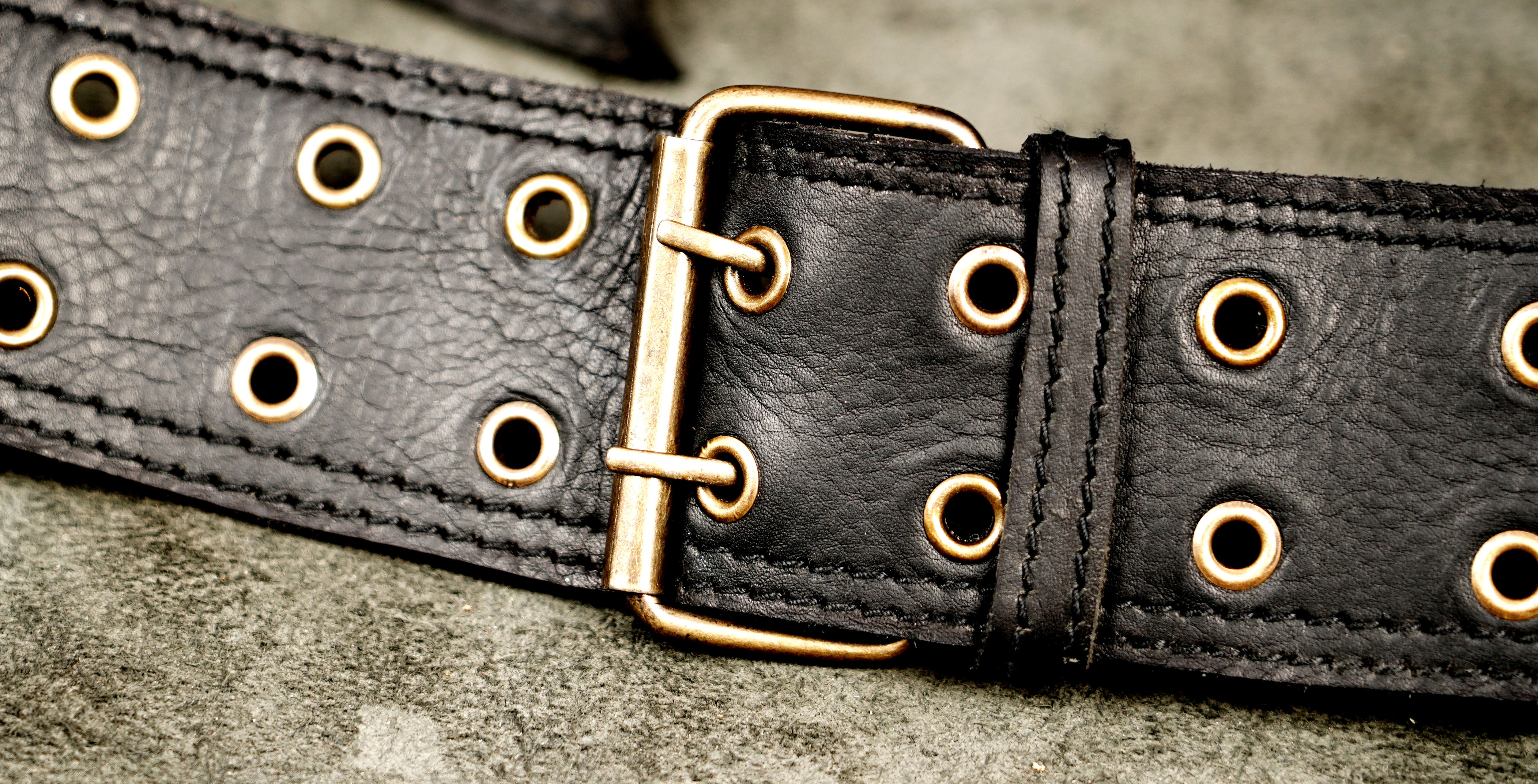 Black leather hip bag belt with brass zipper and side pouch        