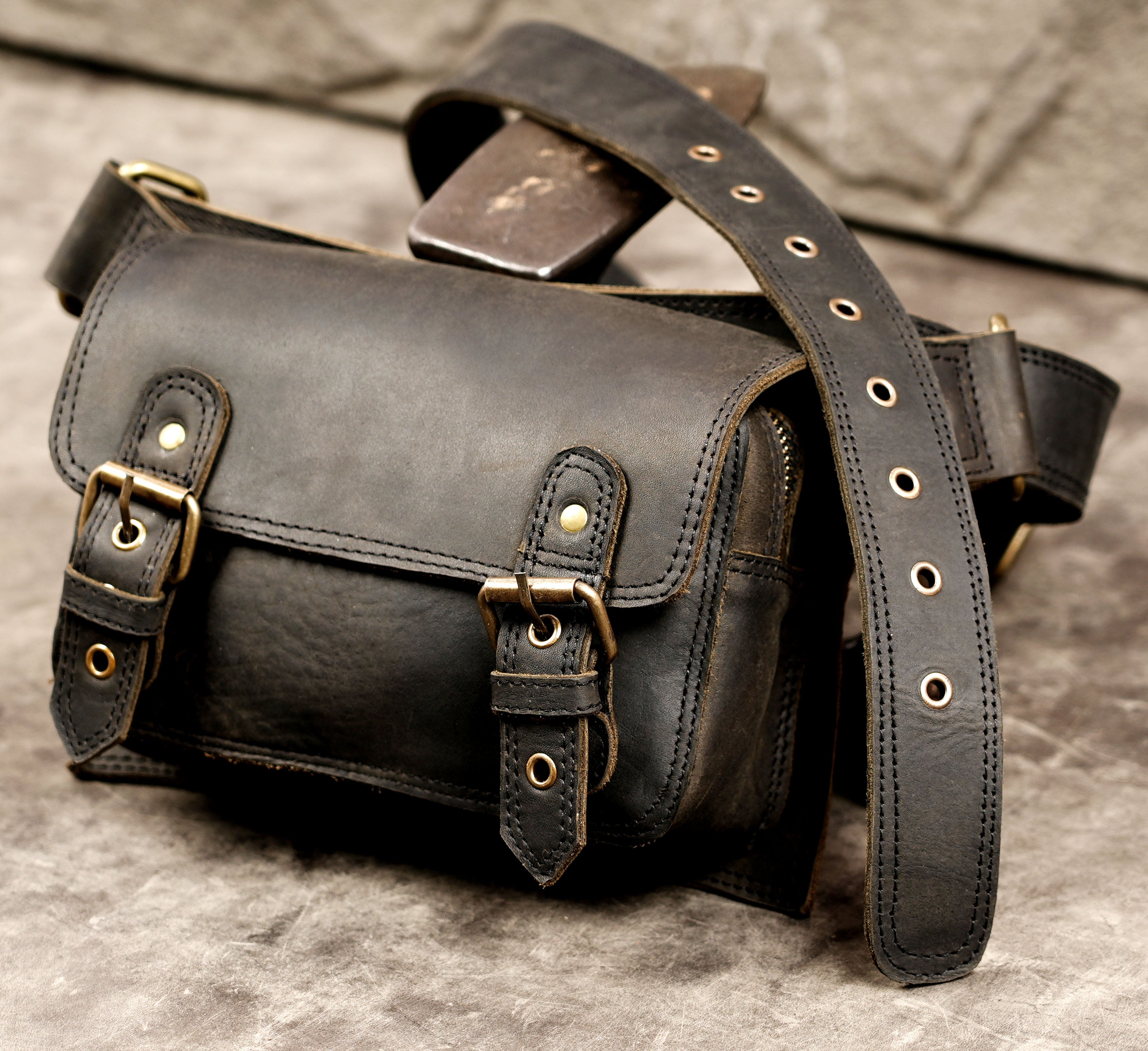Rustic handmade leather hip strap with metal hardware