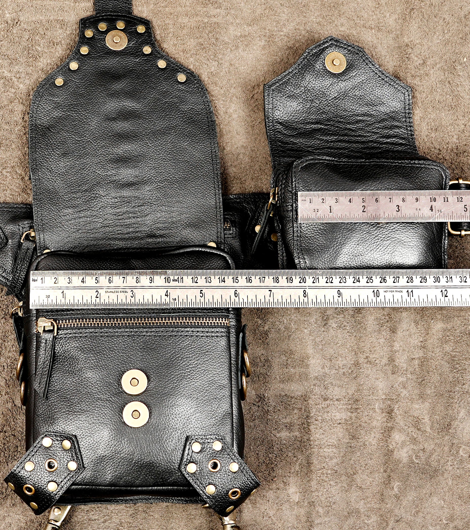 Adjustable black leather hip and leg bag for travelling