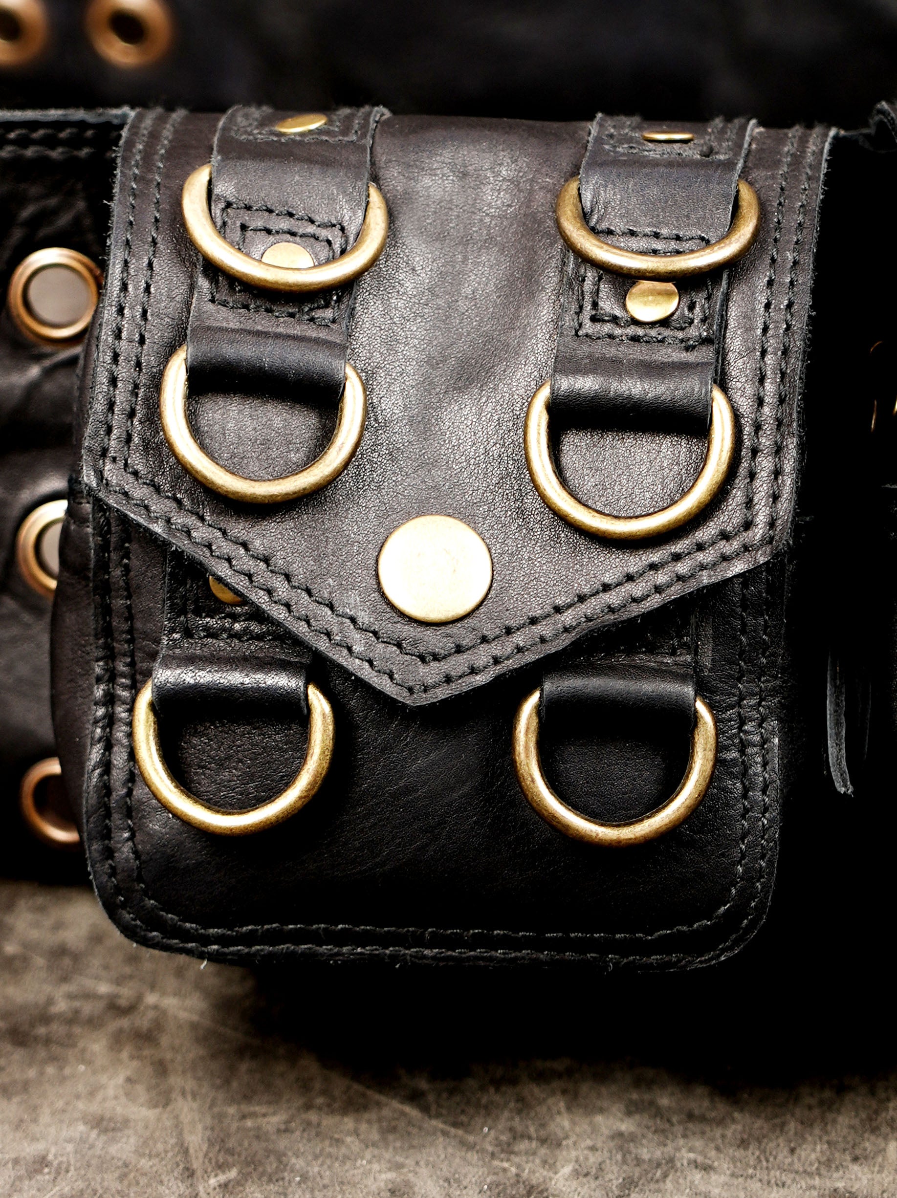 Adjustable black leather hip bag with secure pouches