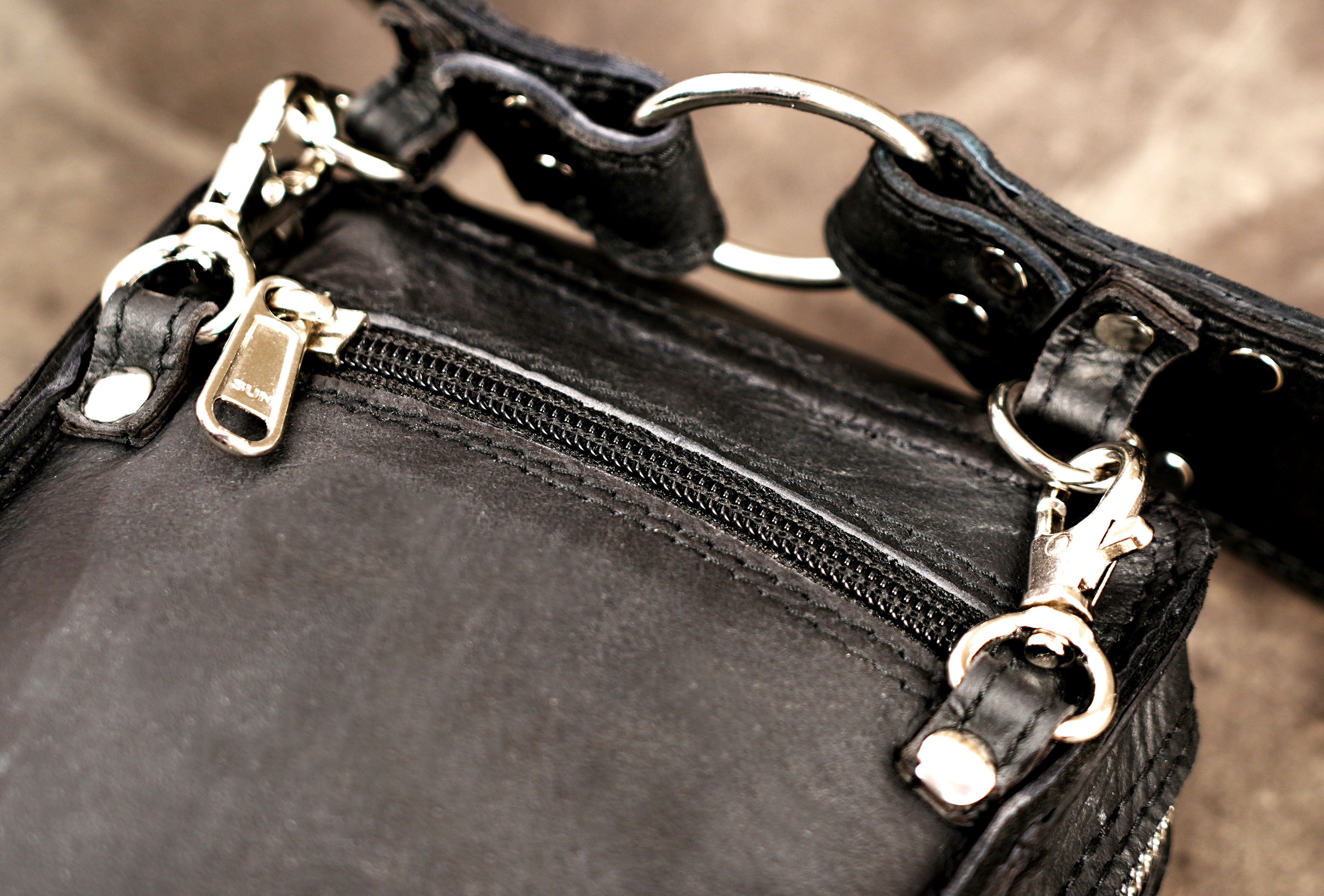 Adjustable black leather waist pouch with crystal accents