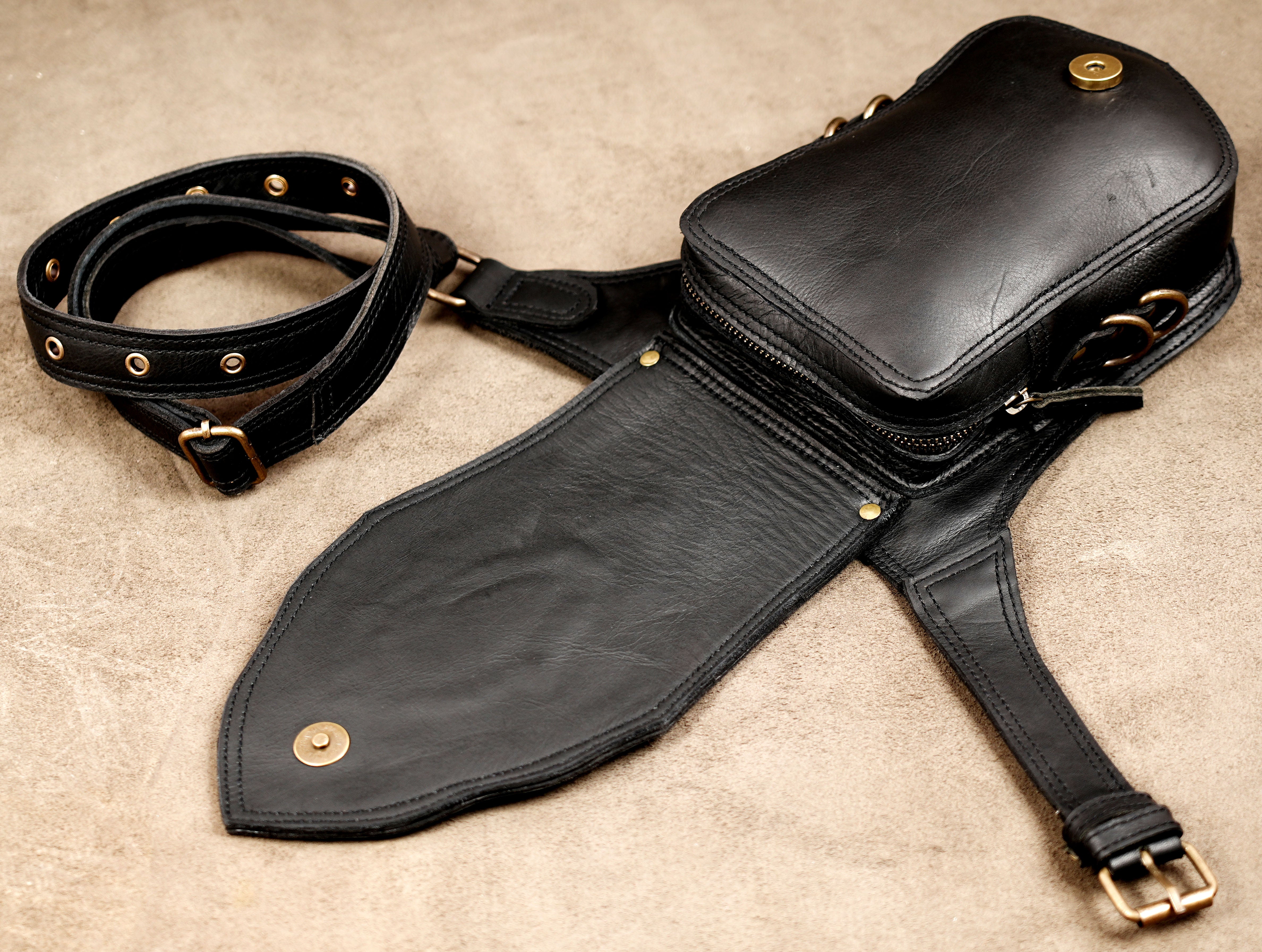 Adjustable black leather waist pouch with practical storage pocket