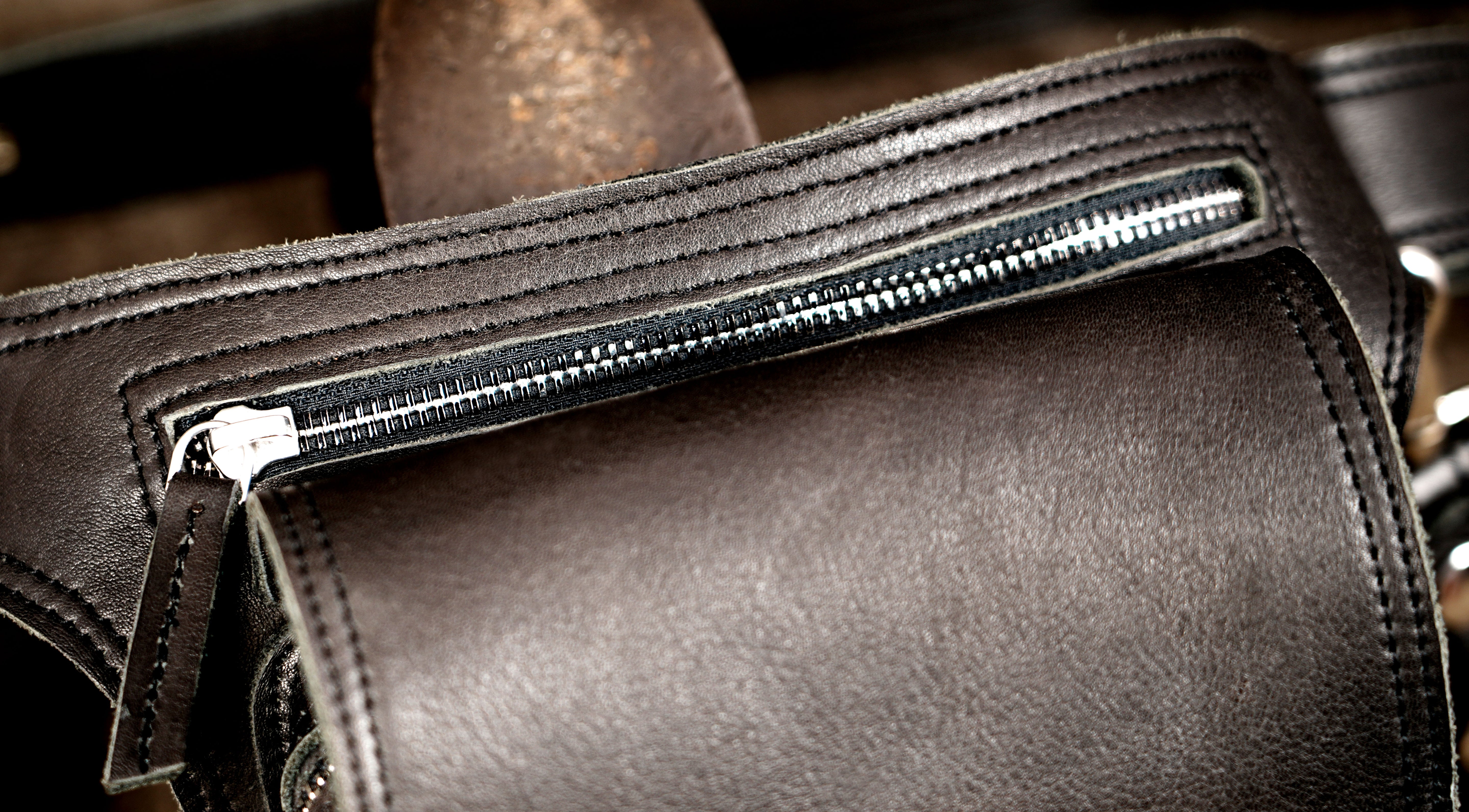 Adjustable leather belt bag with silver clip hardware