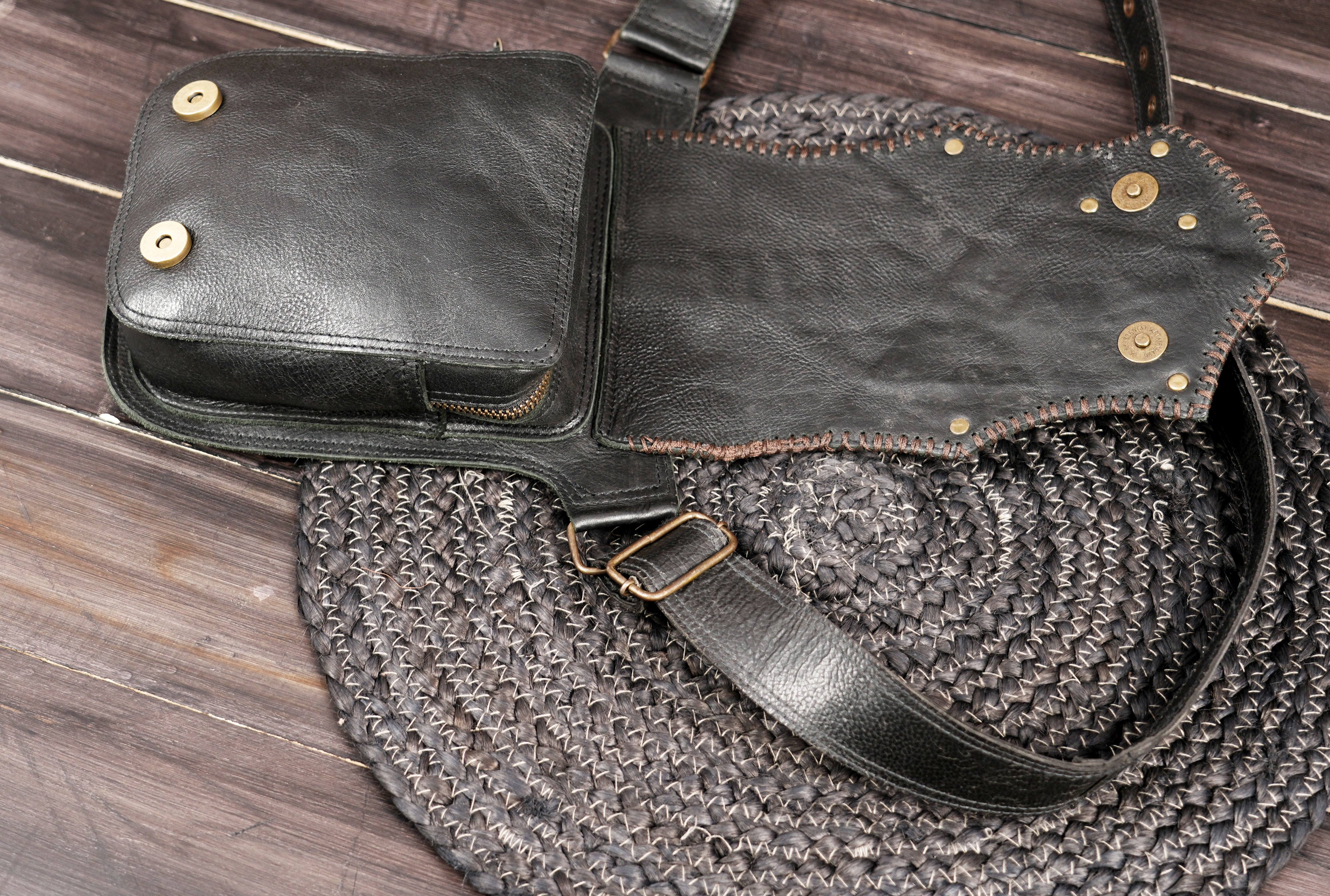 Adjustable leather belt bag with studded flap and gemstone