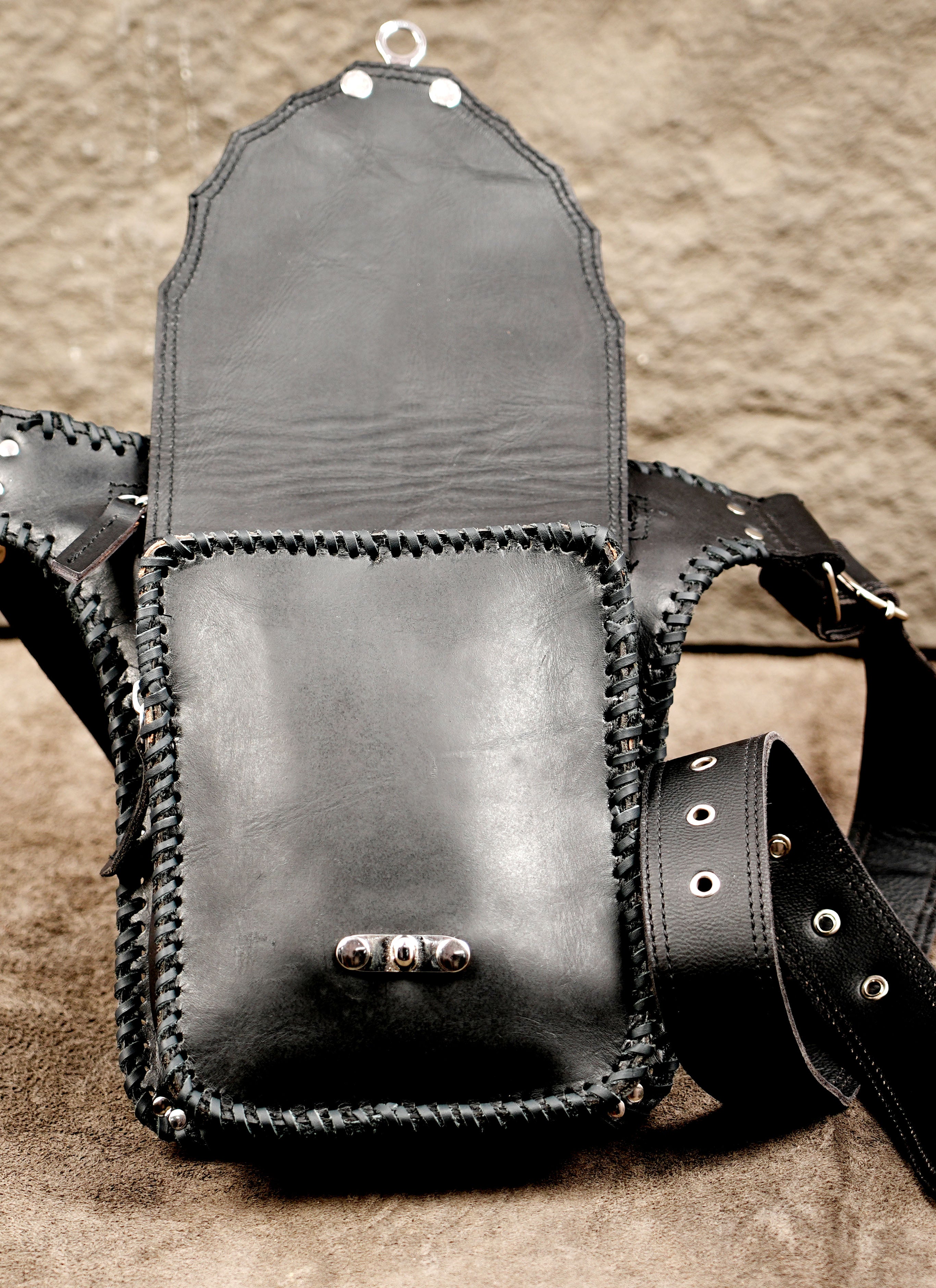 Adjustable leather hip bag with braided edge, full view