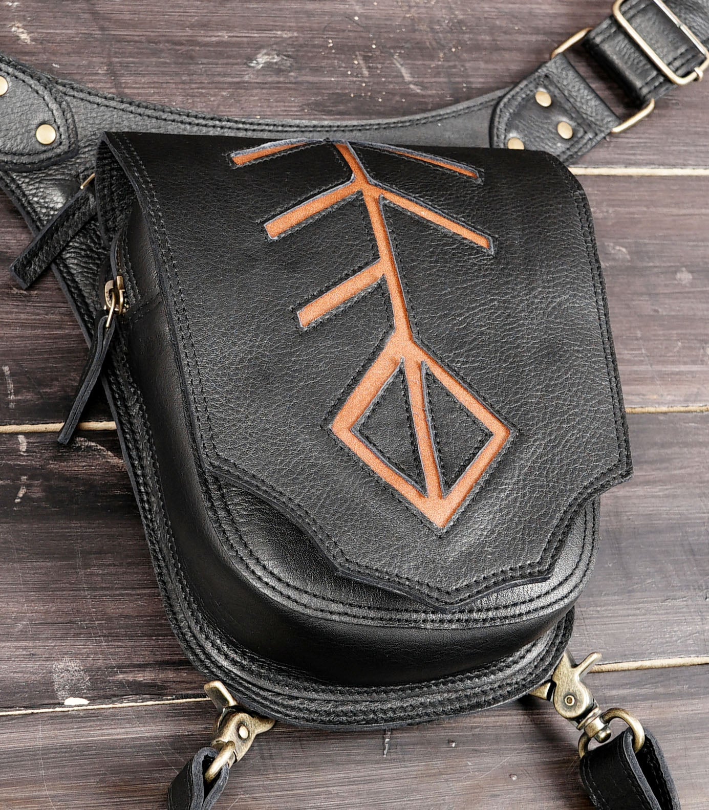 Adjustable leather leg bag with antique brass hardware
