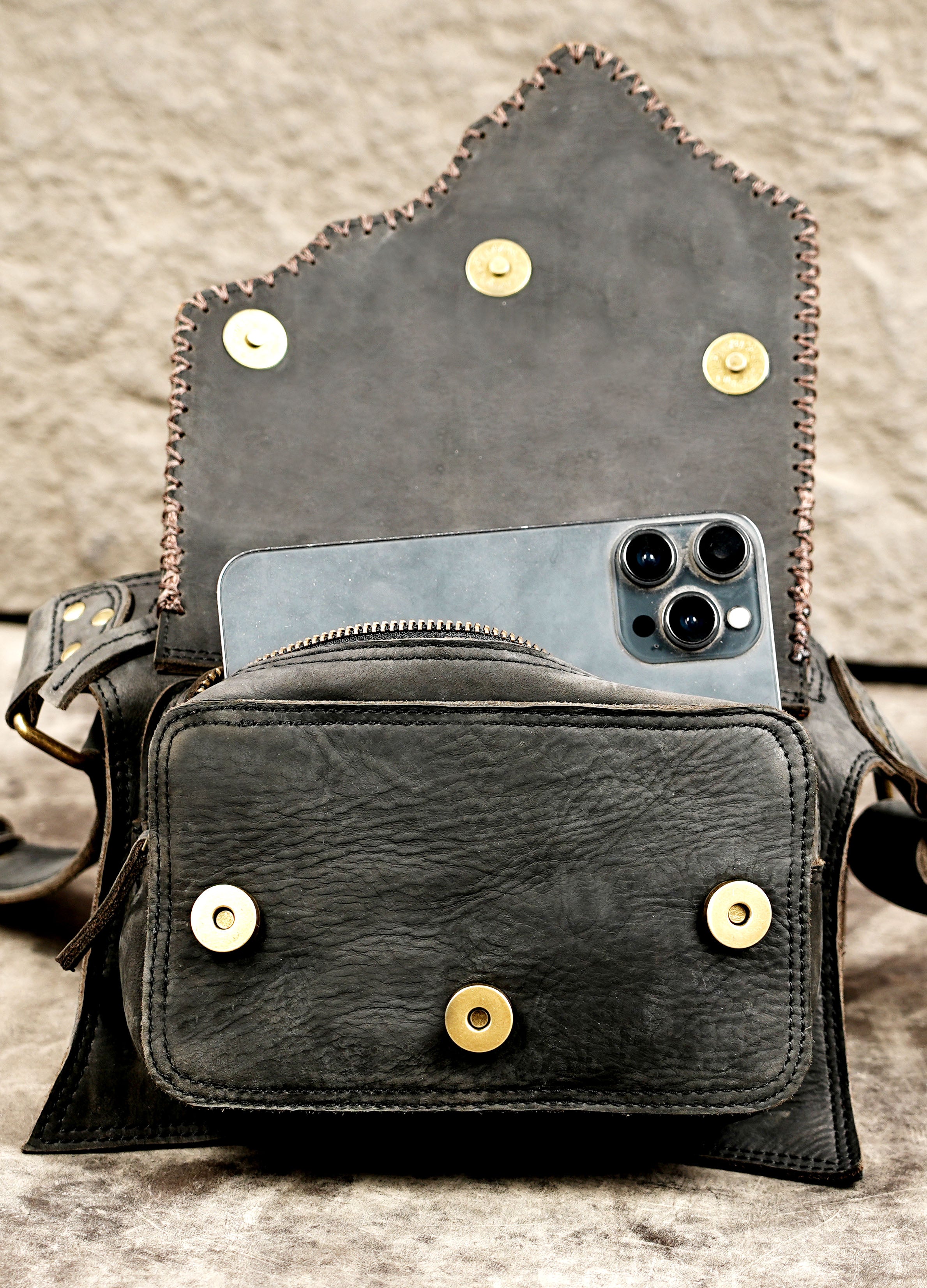 Adjustable leather travel bag for carrying everyday essentials