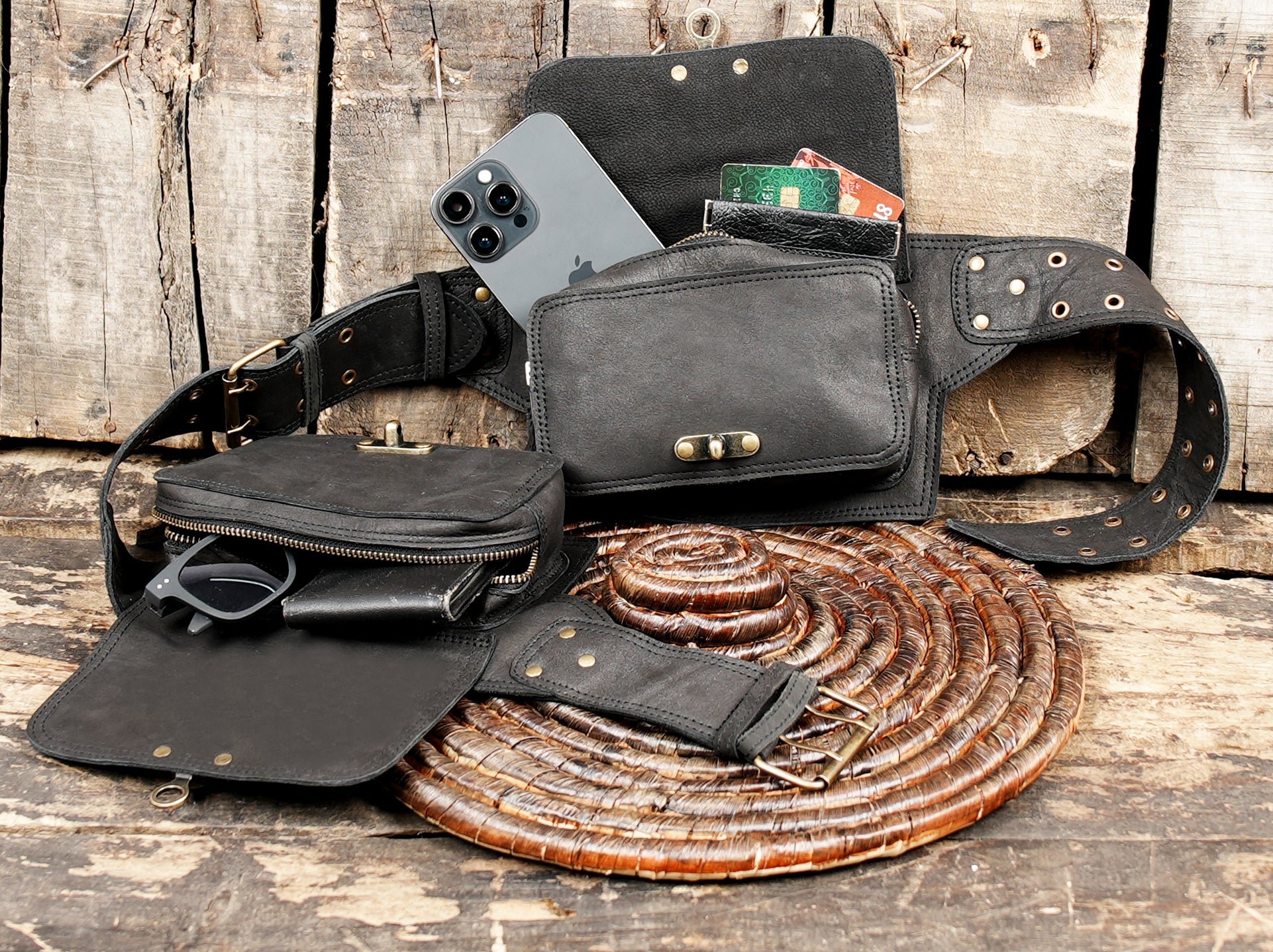Adjustable leather utility belt with brass buckle and grommets