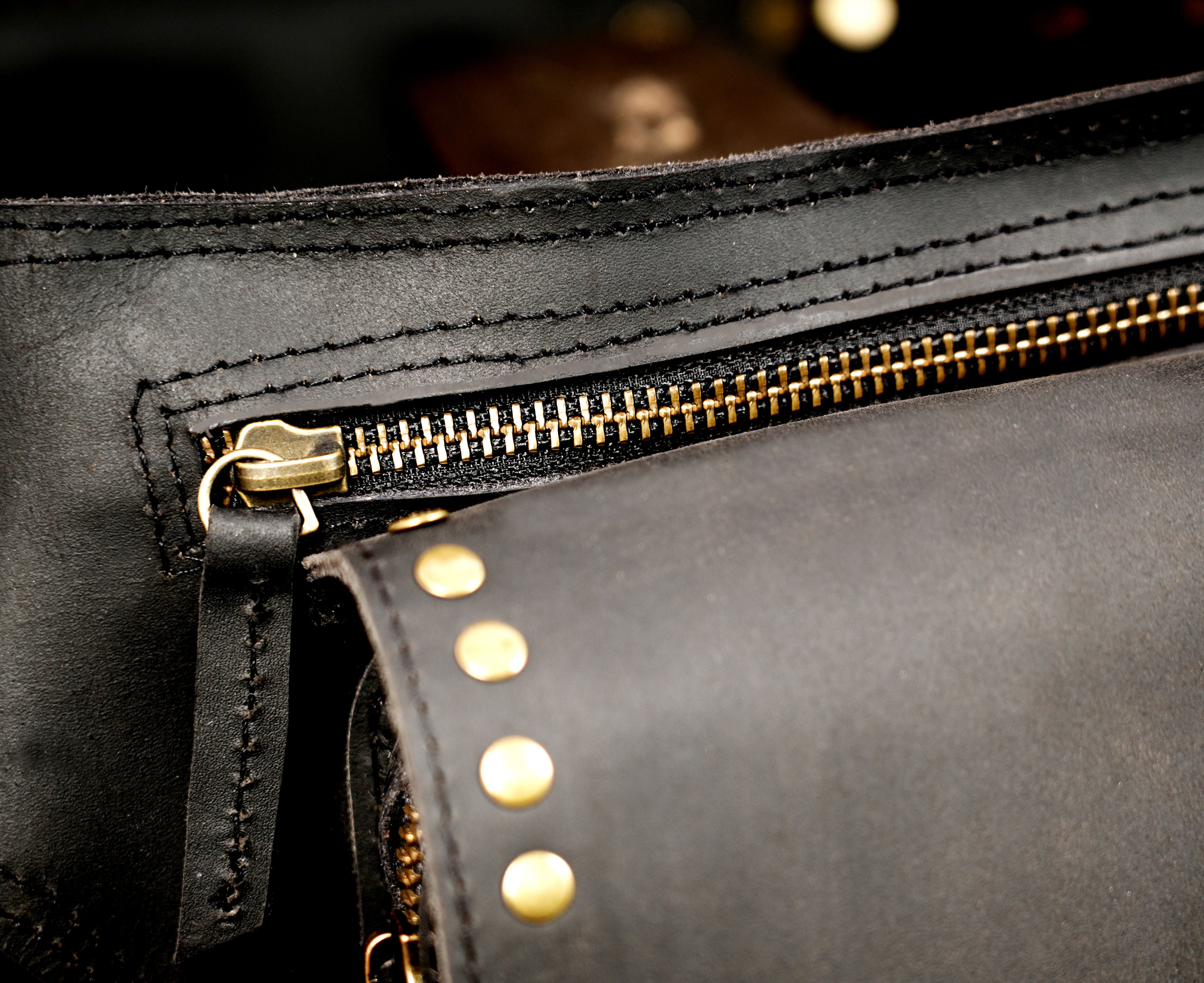Adjustable leather utility belt with brass hardware detail
