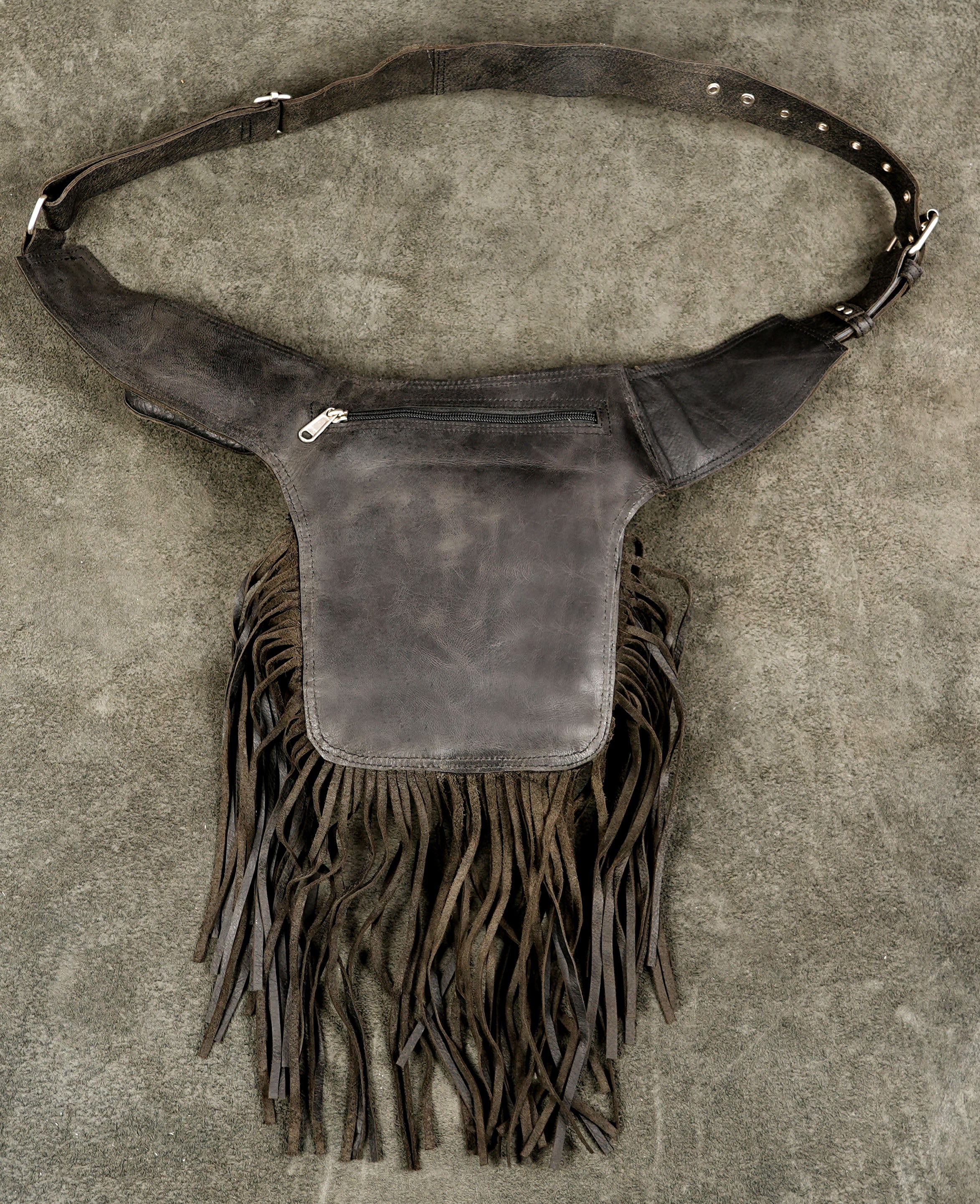 Adjustable leather waist bag with long flowing fringe