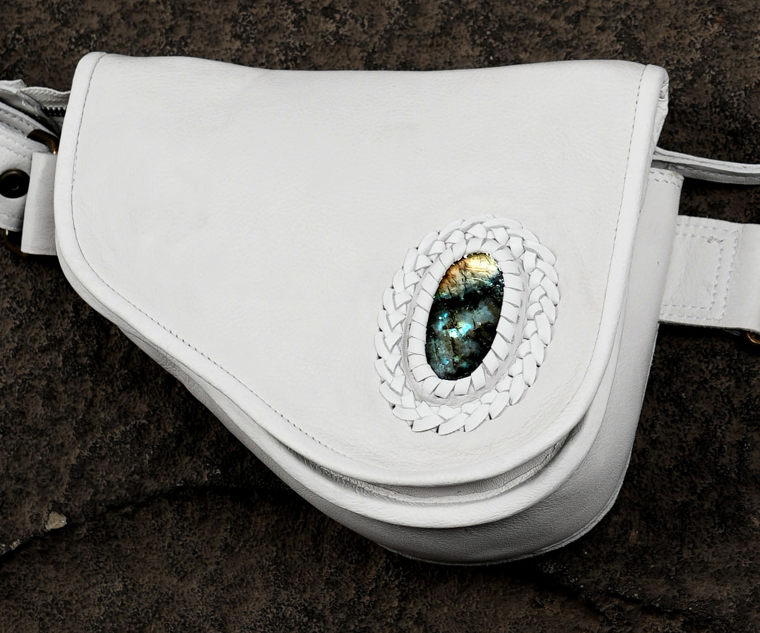 Adjustable white leather waist bag with gemstone centerpiece