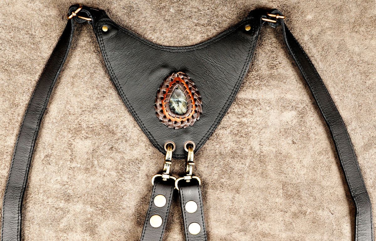 Black leather rave harness bag with decorative stone pocket flaps