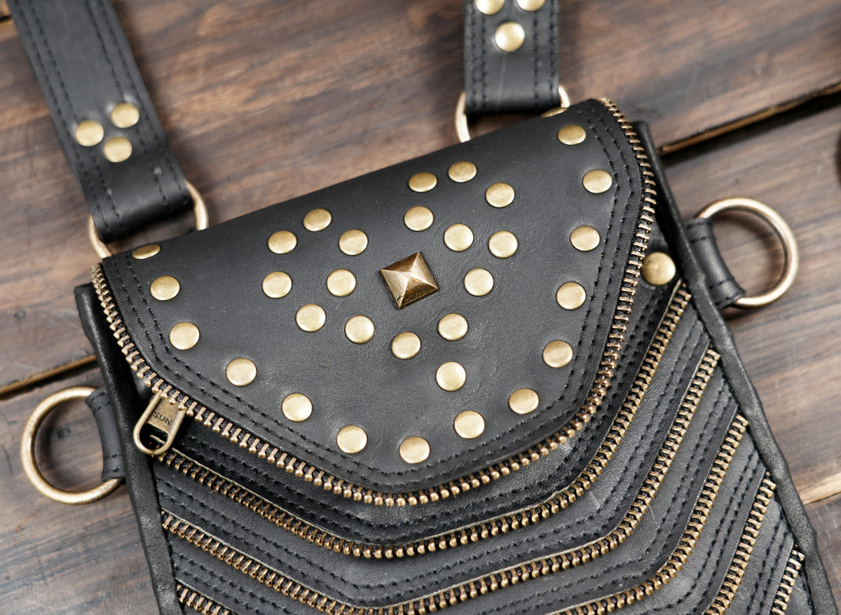 Steampunk leather hip bag harness with matching shoulder straps and metal fasteners
