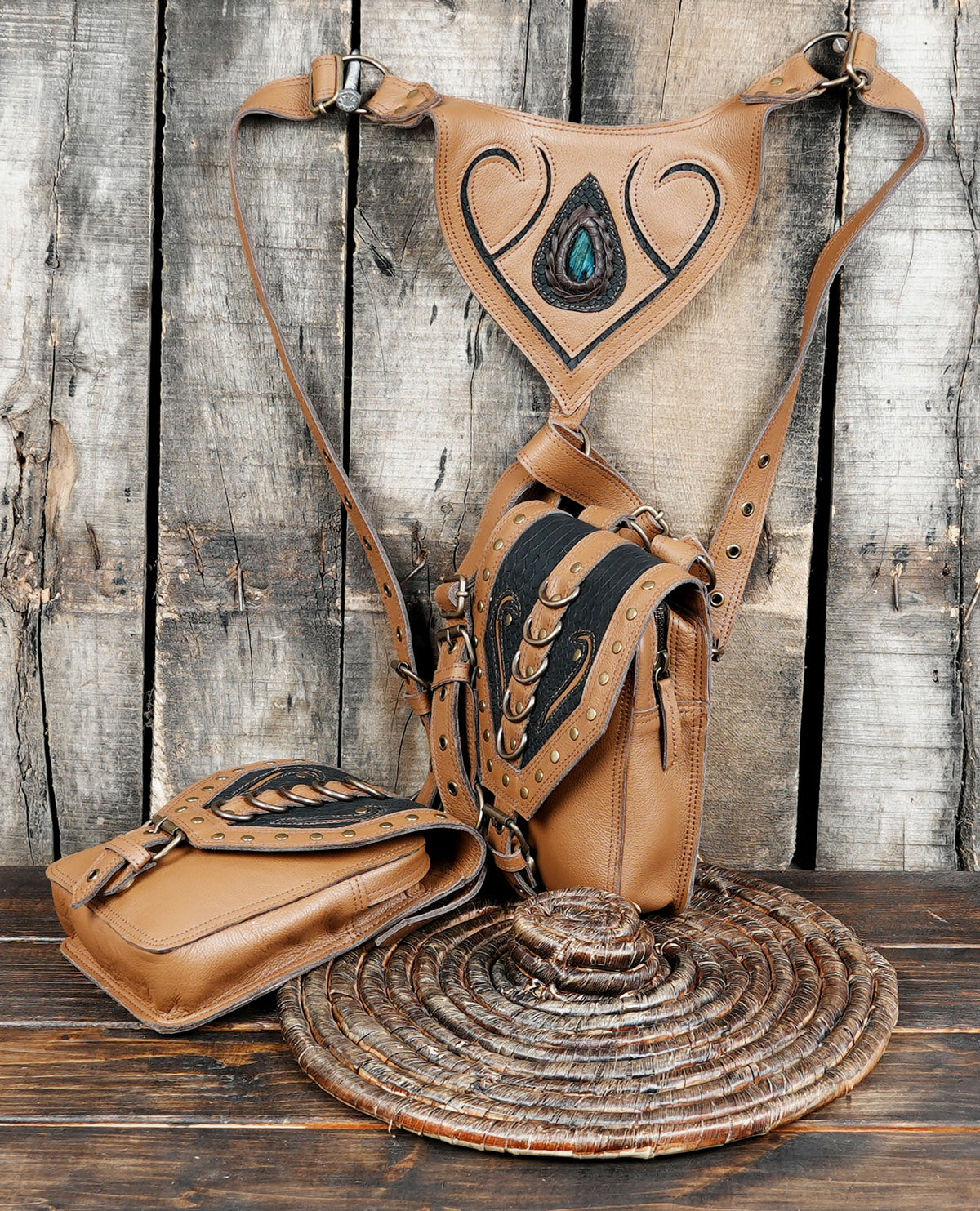 Brown leather chest harness with two utility bags and adjustable straps
