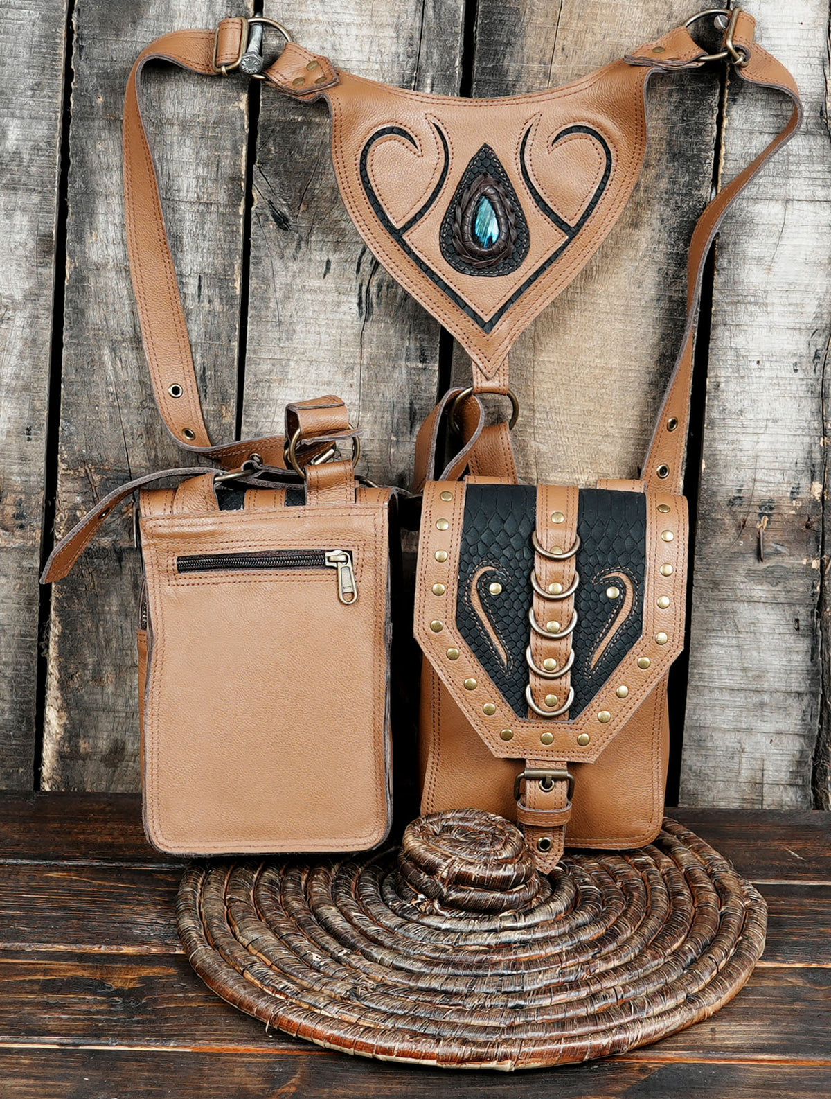 Handcrafted tan leather shoulder bag harness with decorative front pockets