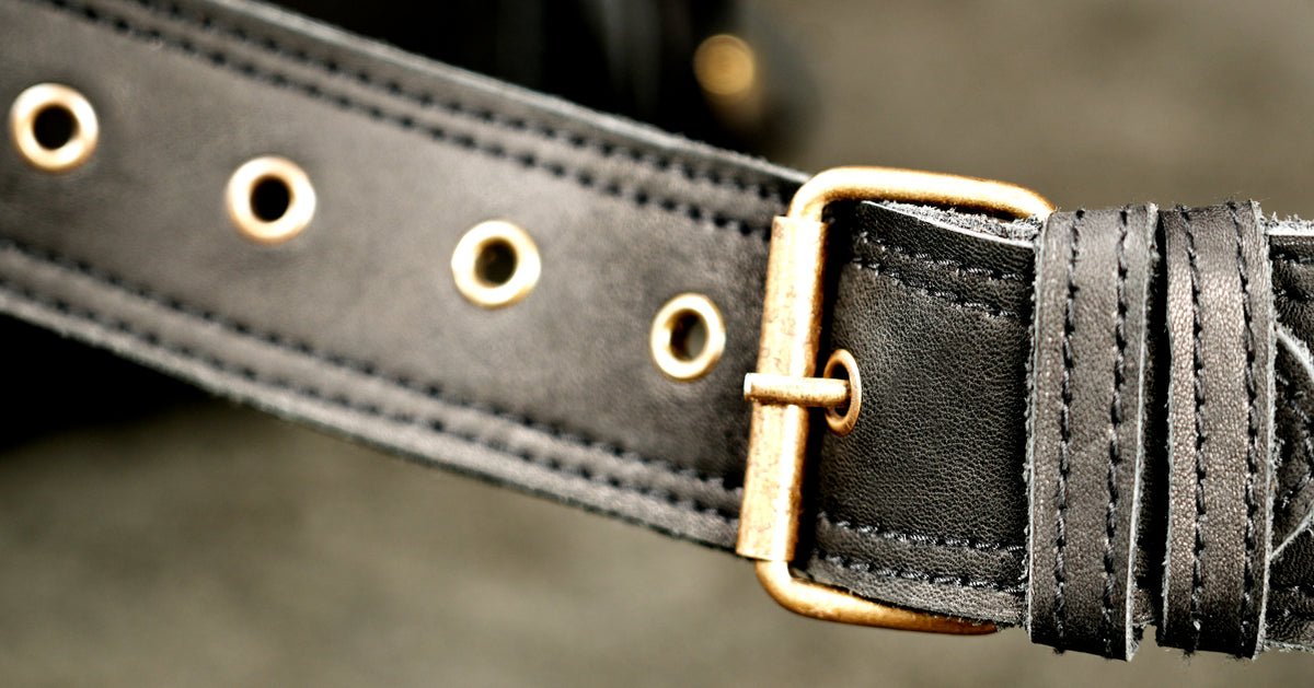 Black leather festival hip pouch with western fringe and adjustable belt.