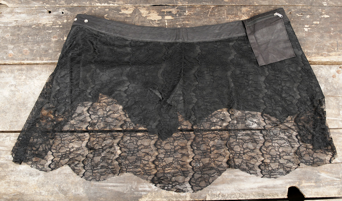 Alternative black skirt with layered leather and lace construction