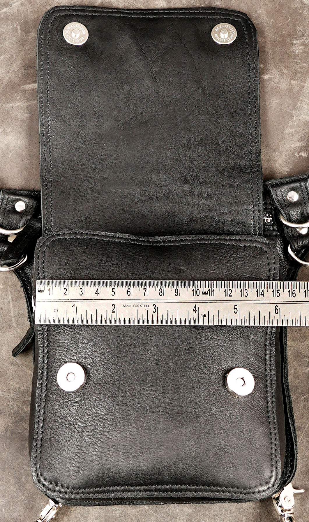Alternative fashion hip bag with metal rings and snap details