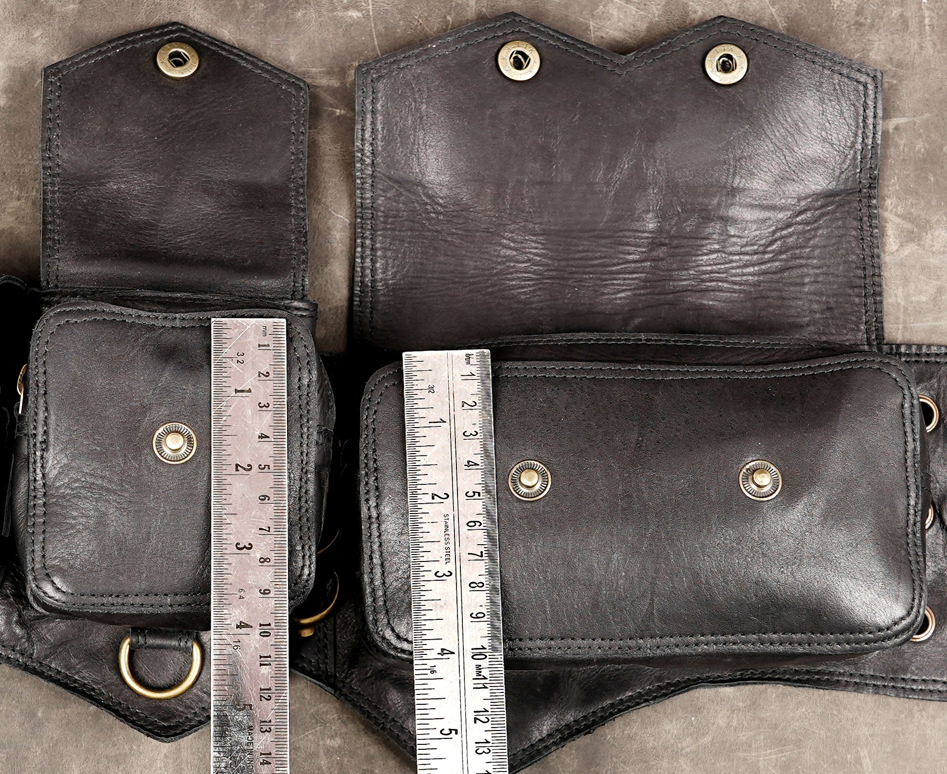 Artisan-made black leather belt bag with brass buckles