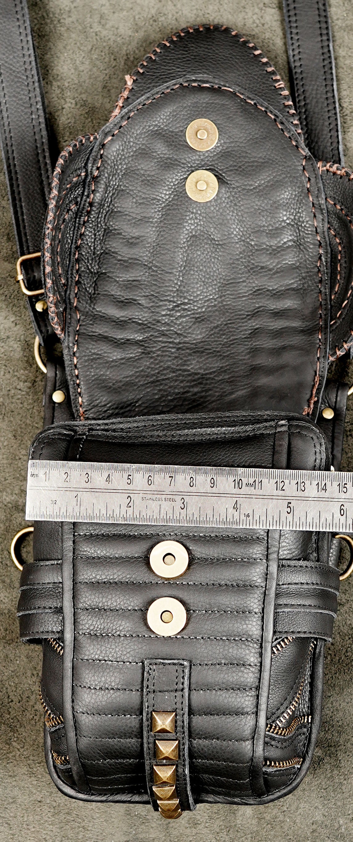 Artisan-made black leather chest harness with decorative pocket flaps