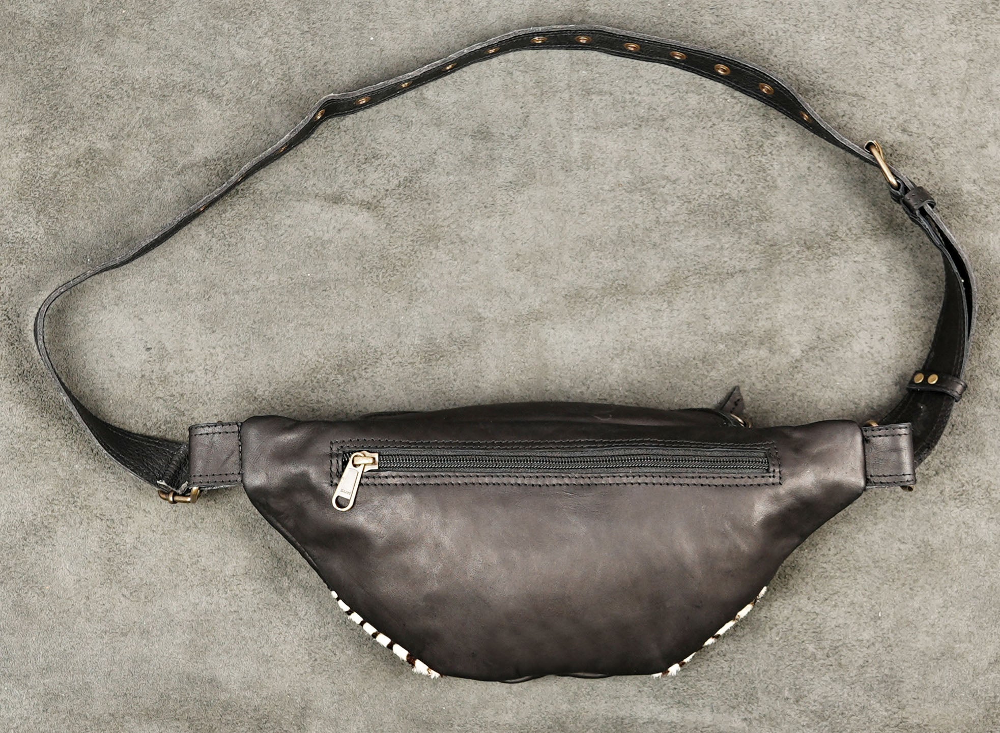 Artisan-made leather shoulder bag with antique brass fittings