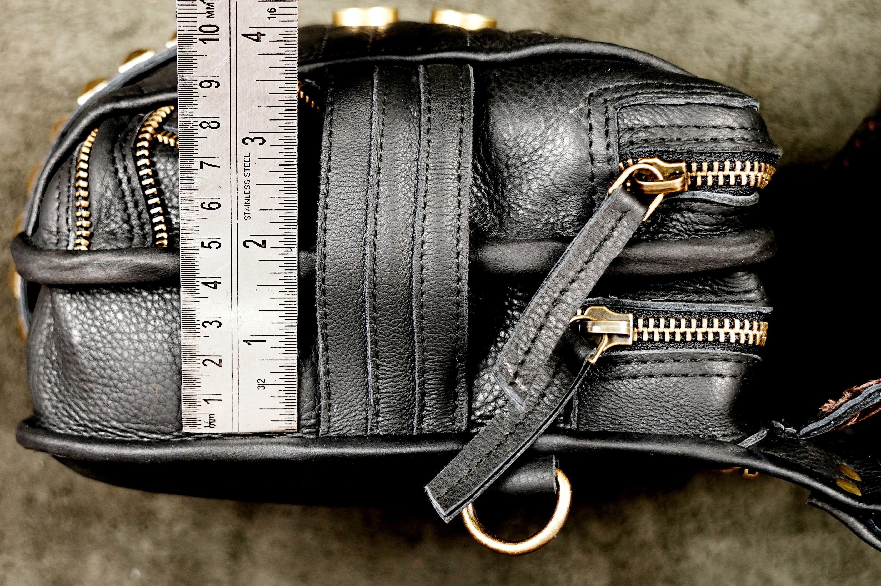 Artisan-made black leather chest harness with decorative pocket flaps