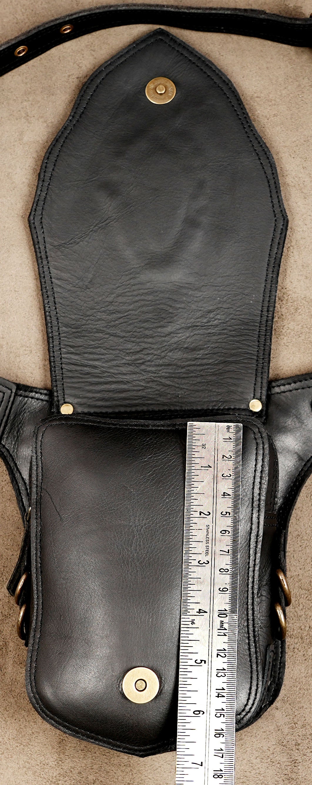 Artisan leather hip bag featuring a natural stone accent