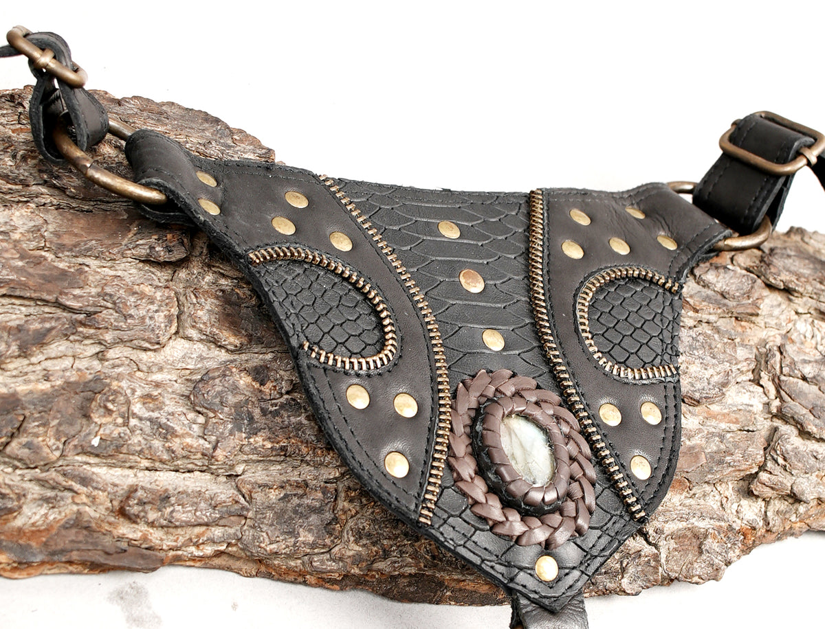 Black leather double holster bag with turquoise stones and gold-tone metal fittings