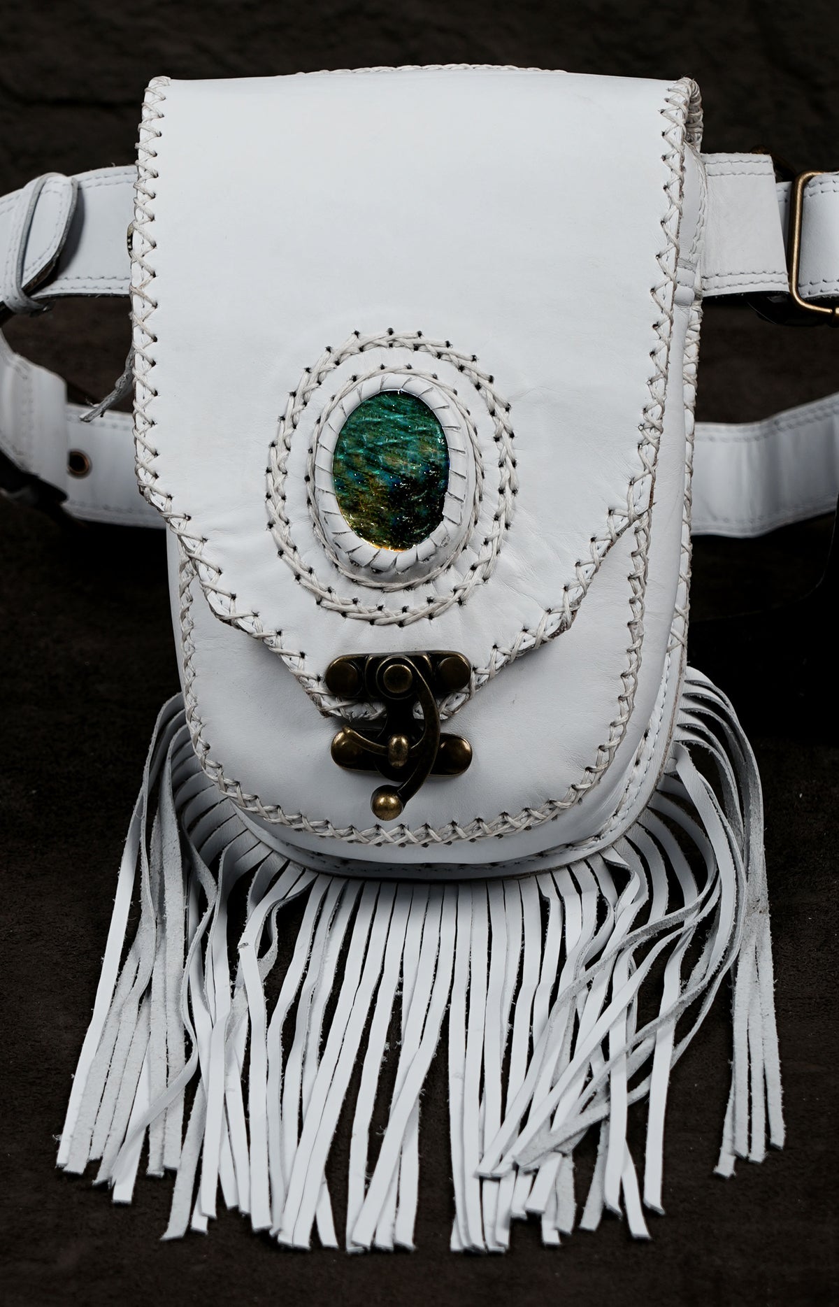 Handmade hip pouch with long leather tassels and adjustable waist beltHandmade hip pouch with long leather tassels and adjustable waist belt