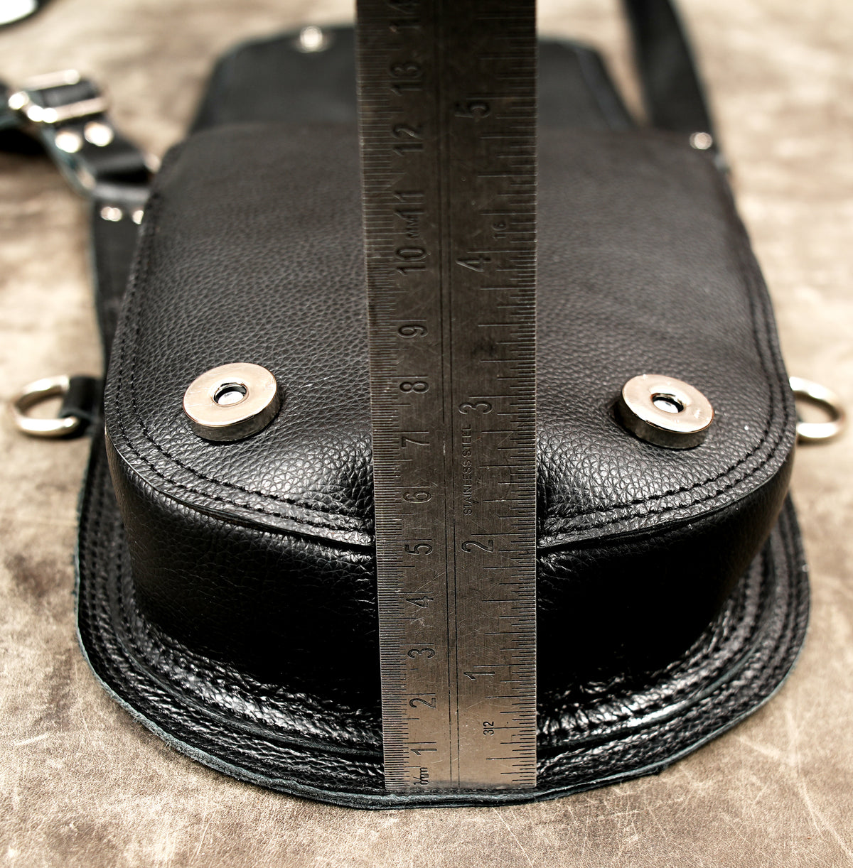 Black and white leather chest rig with detachable connector straps