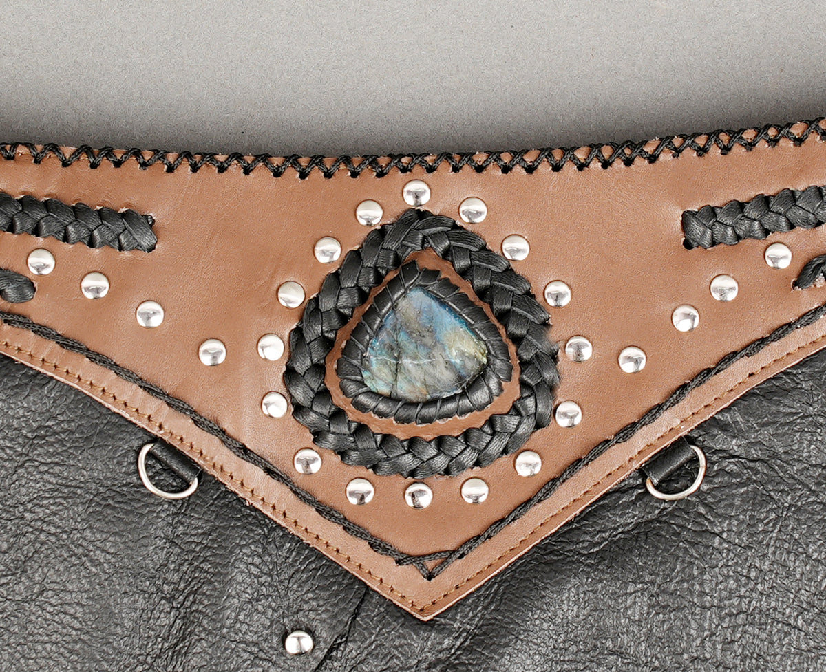 Black asymmetric leather festival skirt with silver-tone stud detailing