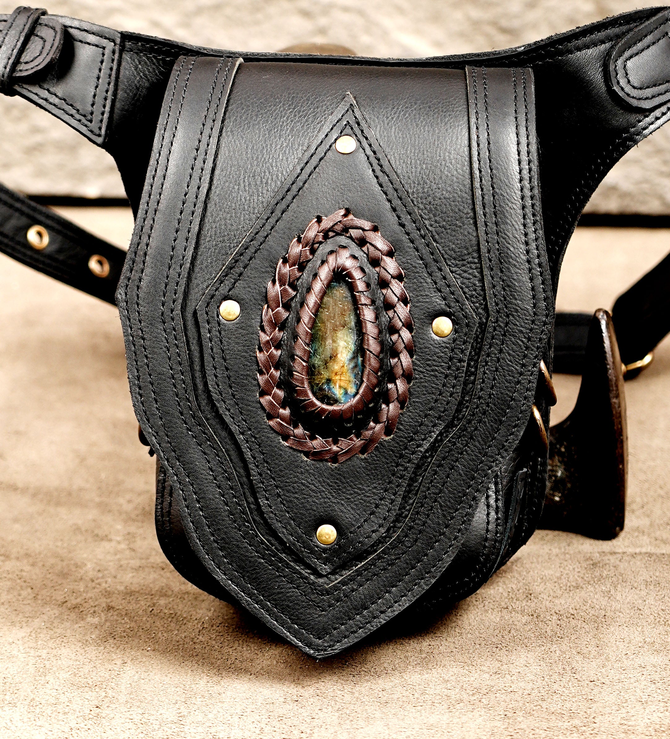 Black leather belt pouch featuring a natural labradorite gemstone