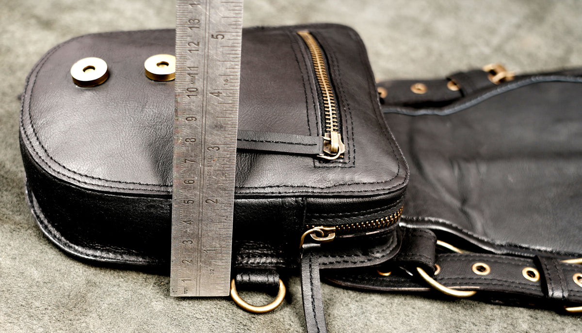 Black leather double hip pouch belt with antique brass tone rings and decorative studs
 