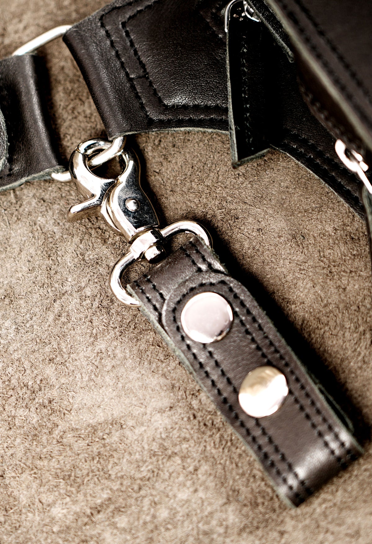 Black leather crossbody pouch with snap button detail