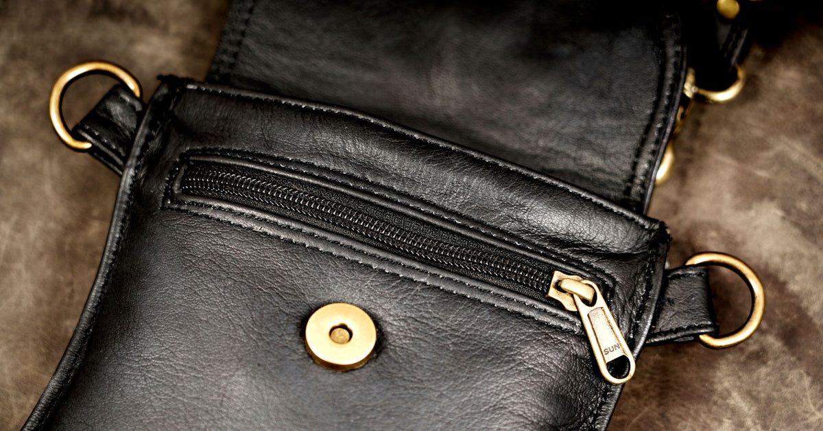Leather festival harness with two black utility bags and metal hardware
