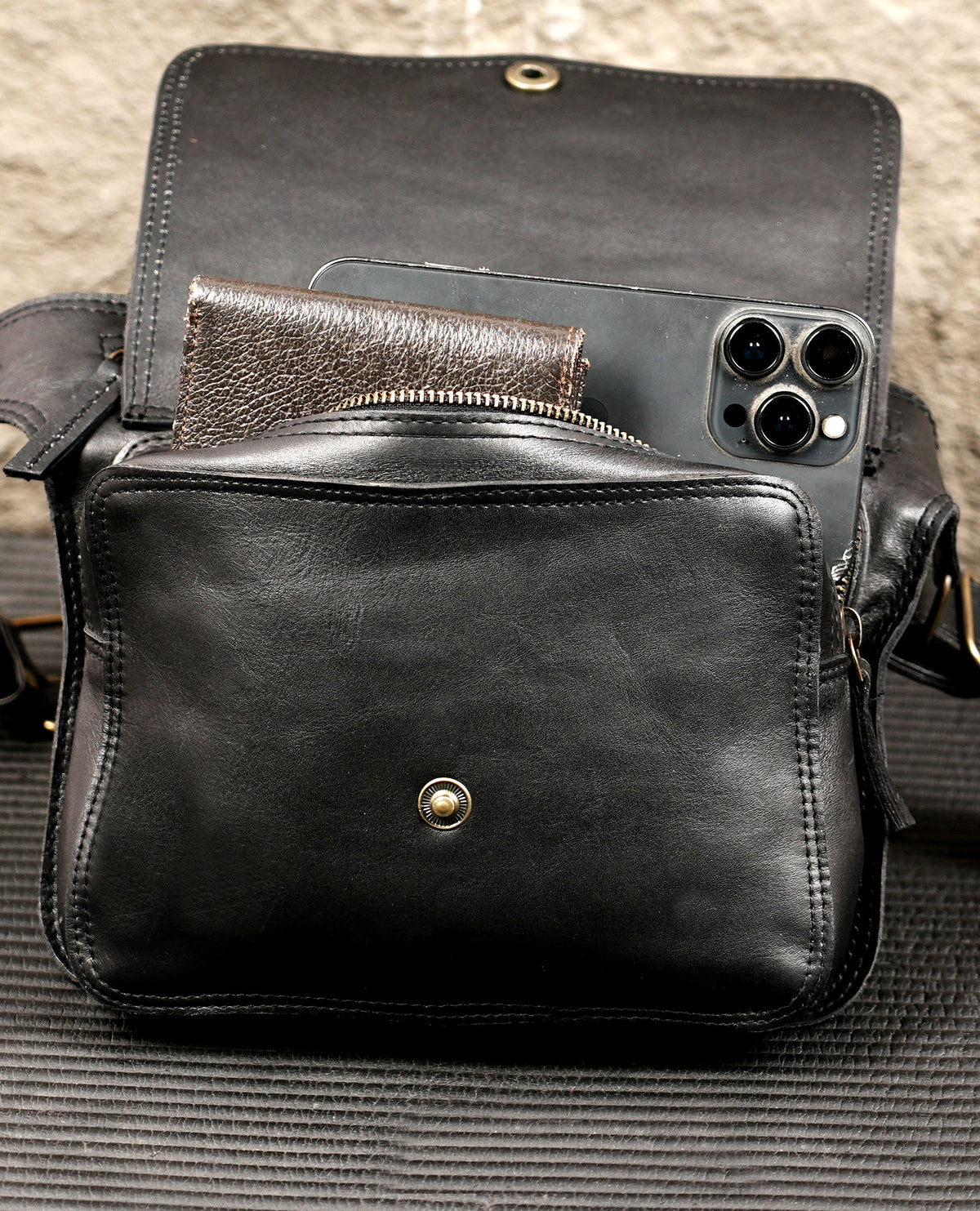 Black leather festival bag with brass snap and zip detail