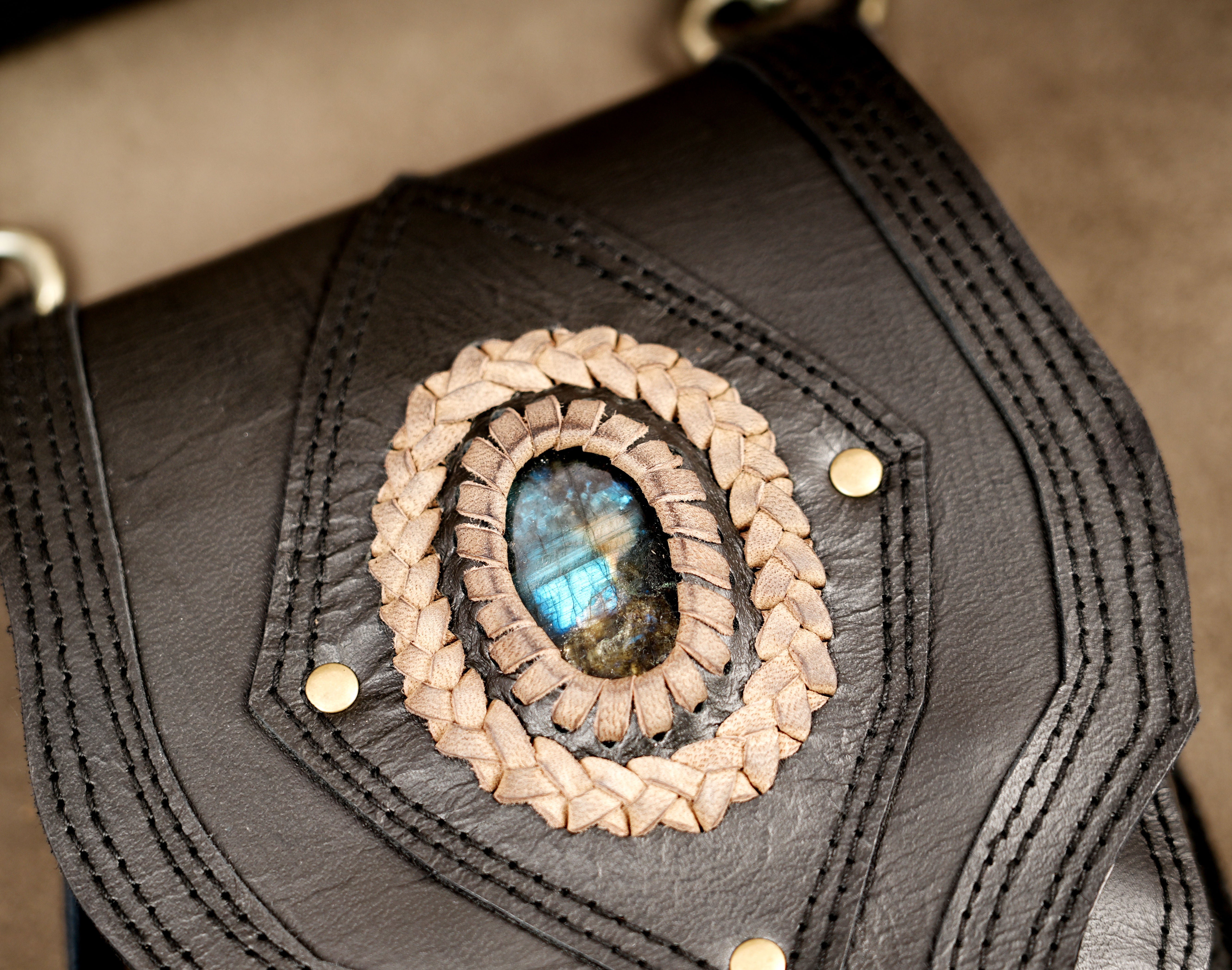 Black leather festival waist bag with antique brass hardware