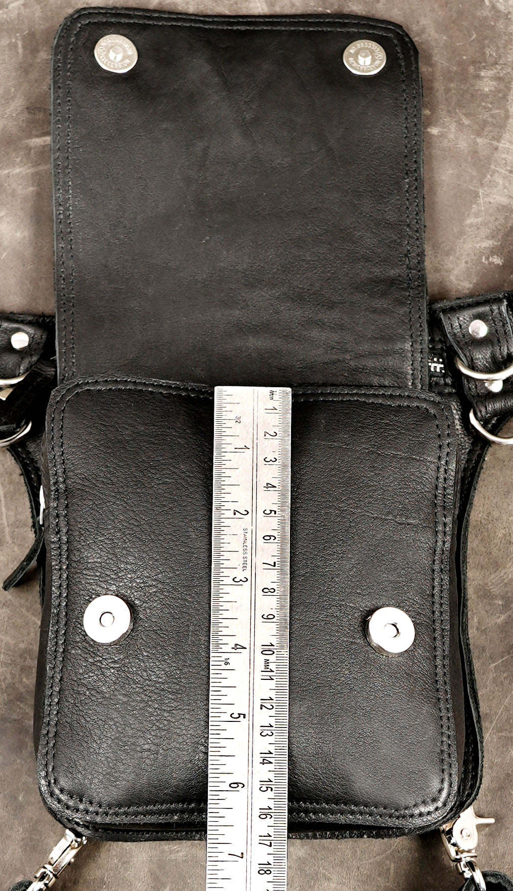 Black leather rave pouch with a practical drop-leg design