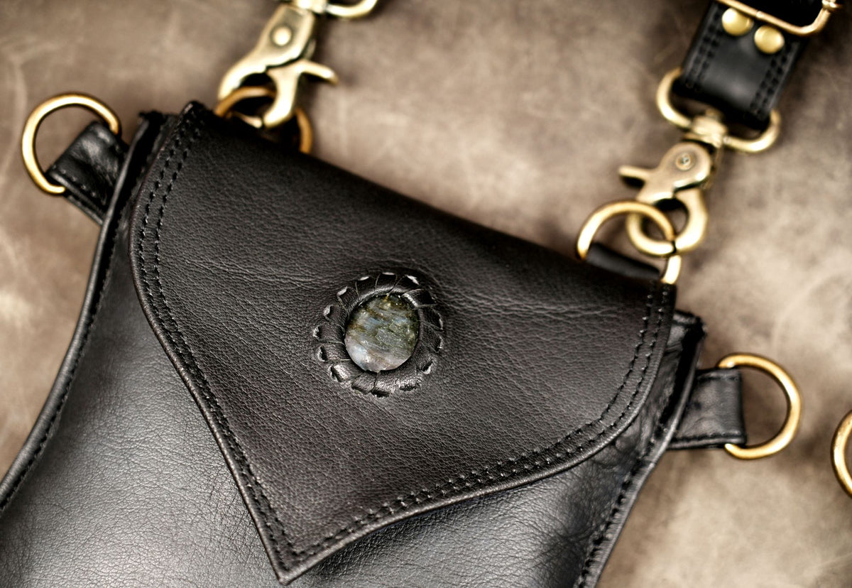 Leather festival harness with two black utility bags and metal hardware