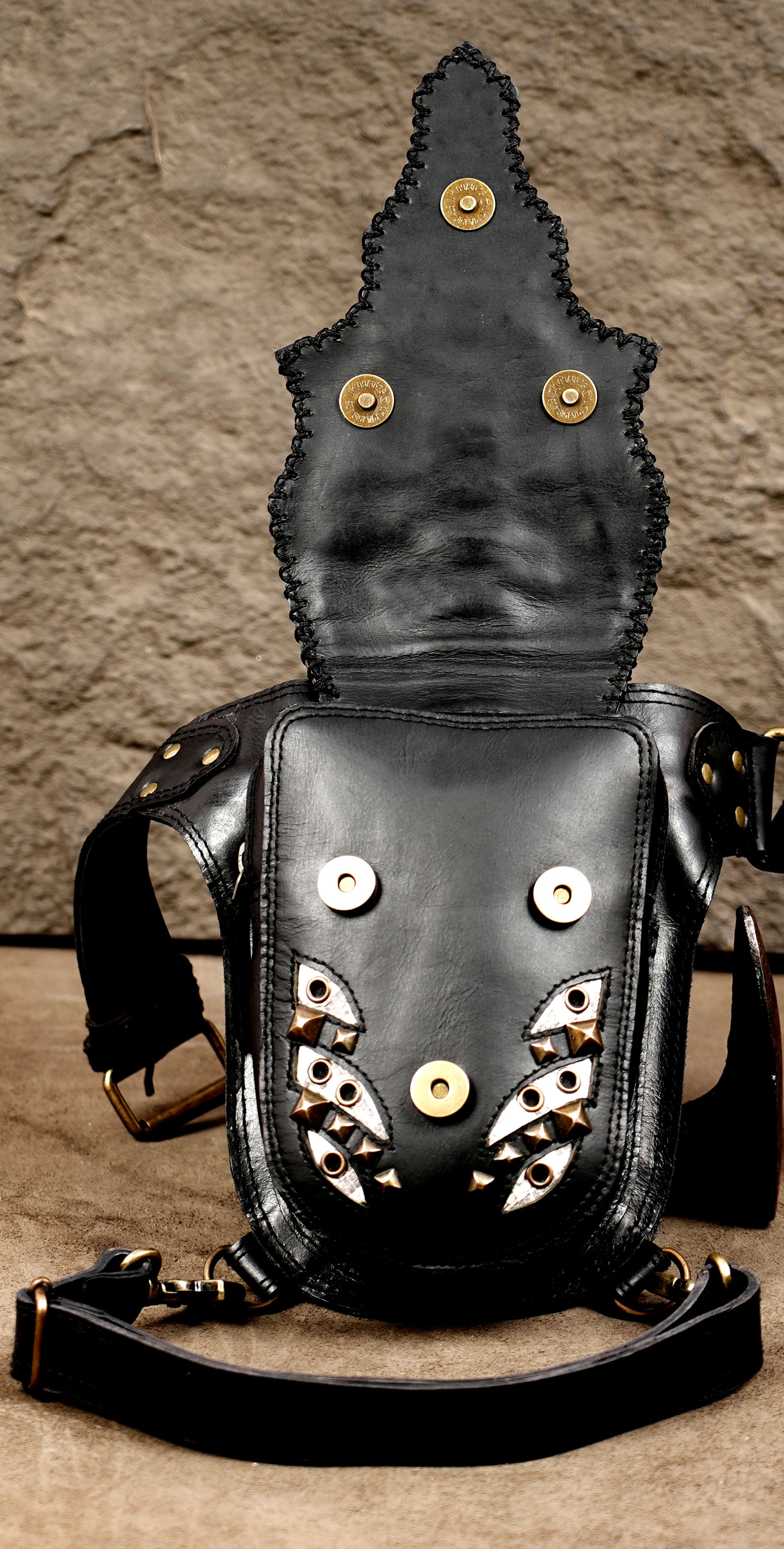 Black leather travel pouch with adjustable belt and leg strap